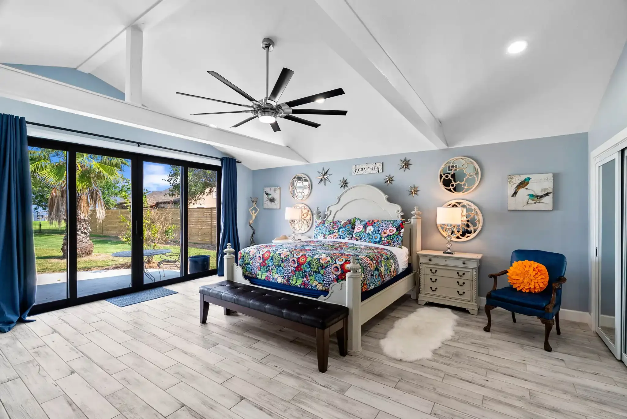Waterfront primary bedroom with bay views and private patio access in a luxury Rockport TX vacation rental.