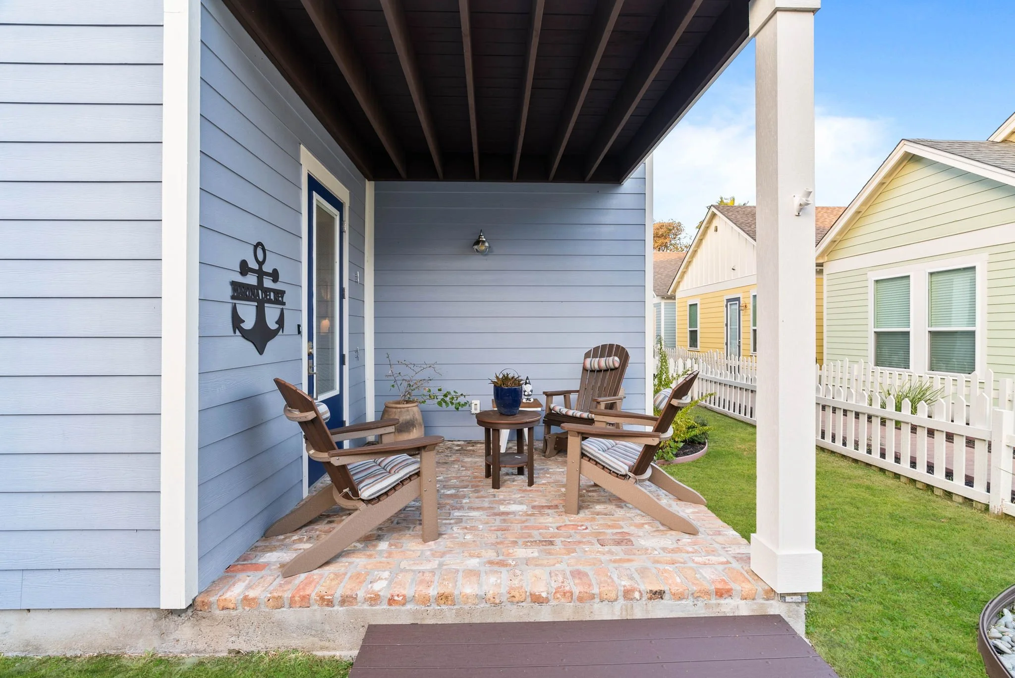 Covered patio with Adirondack chairs at Marina Del Rey vacation rental in Rockport Texas