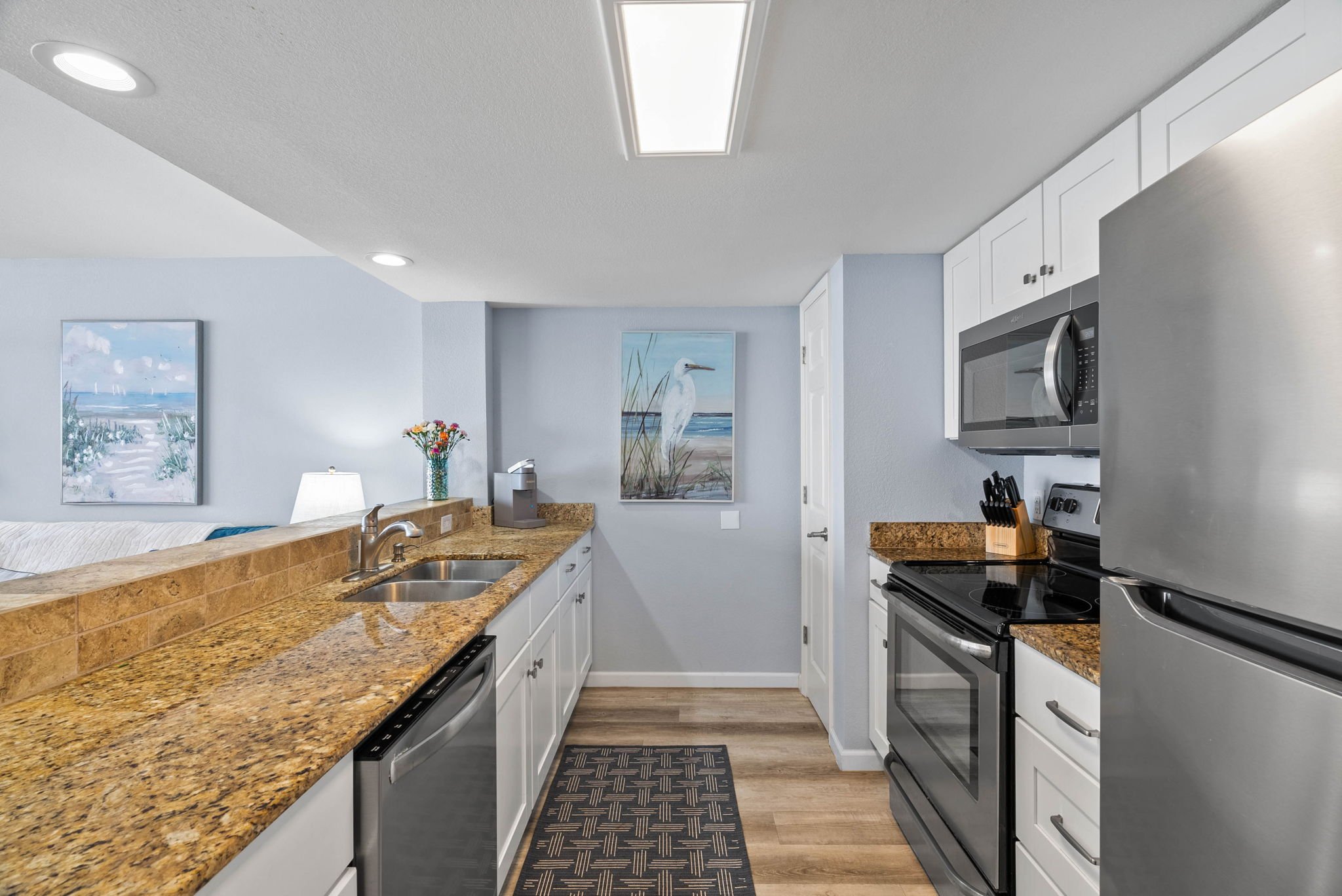 Modern kitchen with granite counters and stainless appliances at Dayspring 402 Laguna Reef Rockport TX