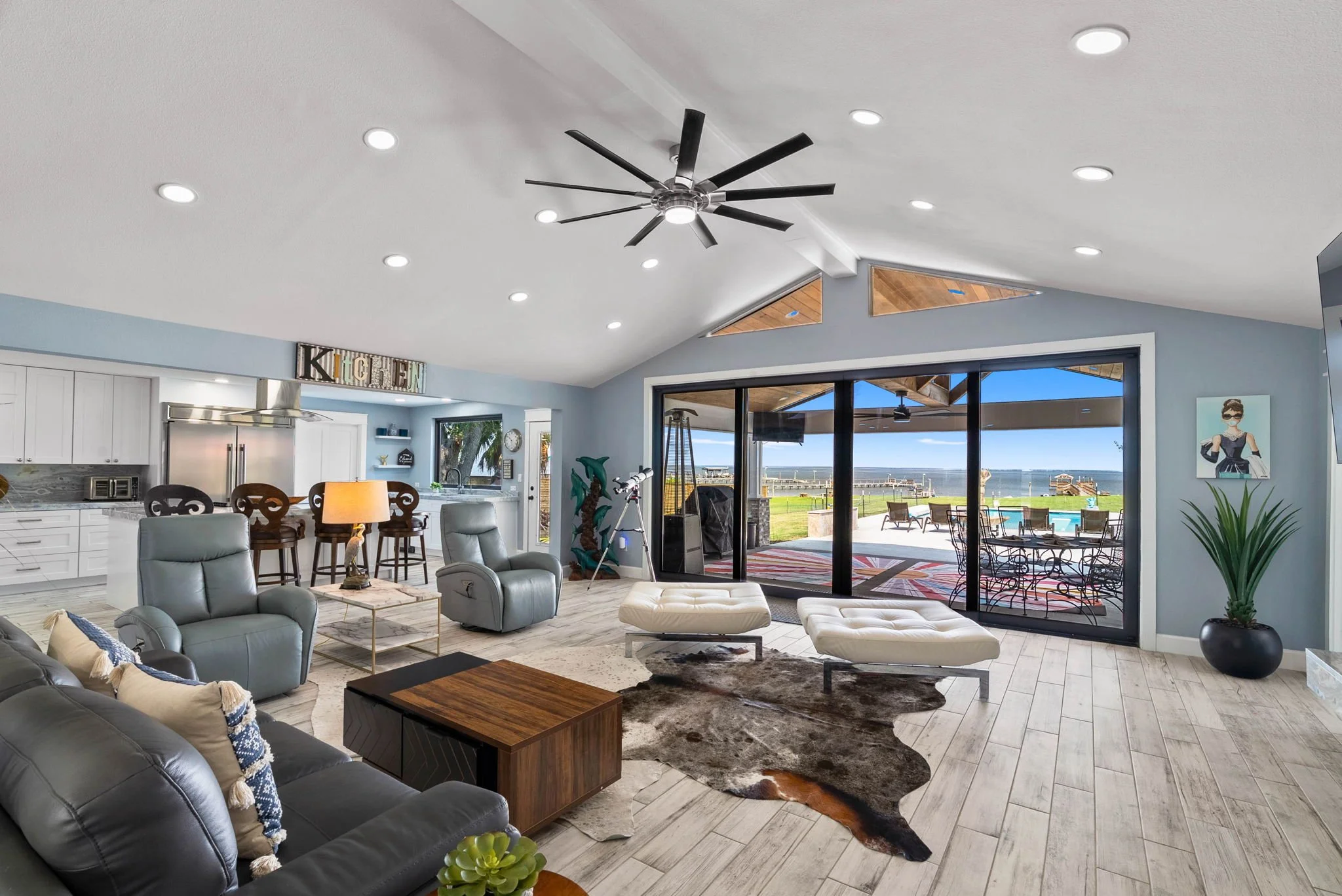 Spacious waterfront living area with panoramic bay views in a luxury Rockport TX vacation rental.