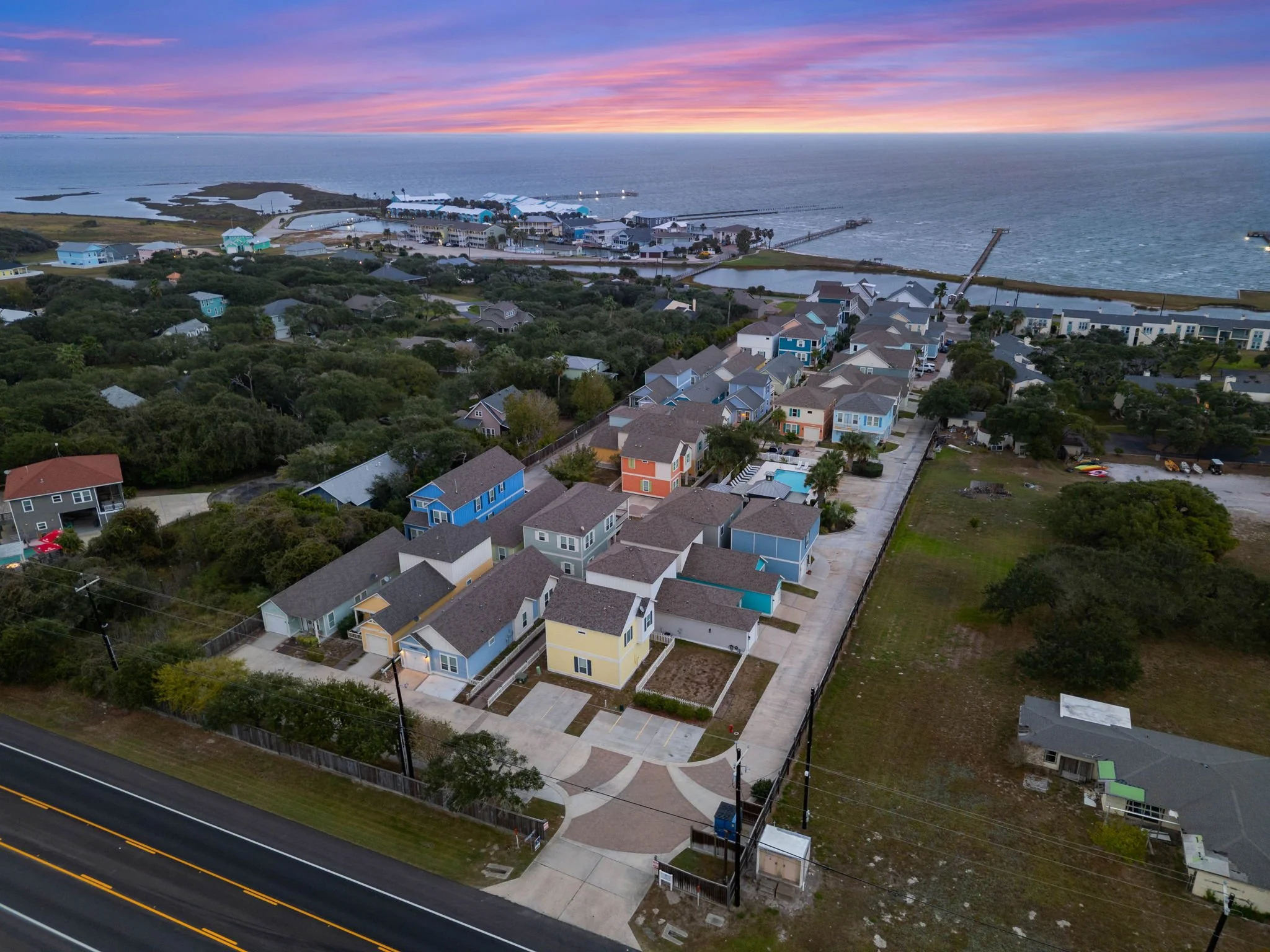 Aerial photo of Marina Del Rey vacation rental community in Rockport TX at sunset, near the waterfront