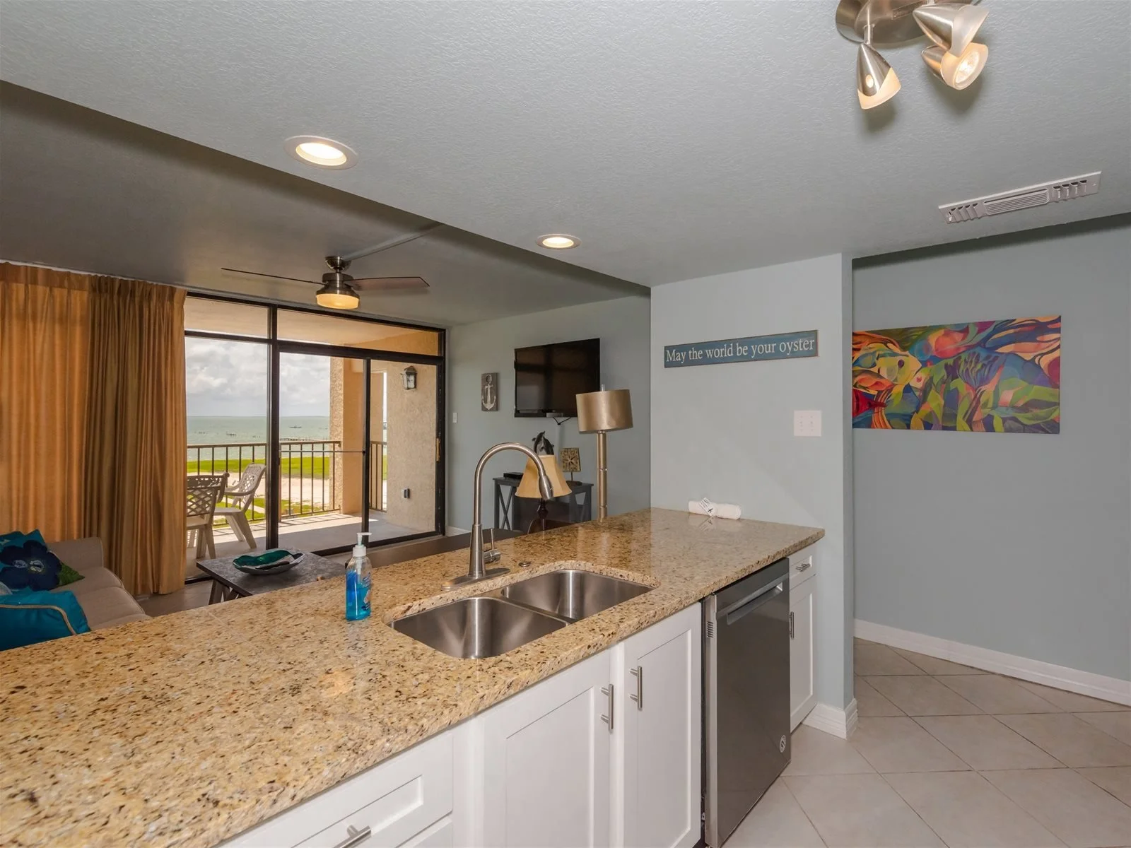 Fully equipped kitchen with stove, microwave, and refrigerator – Tradewinds vacation rental Rockport