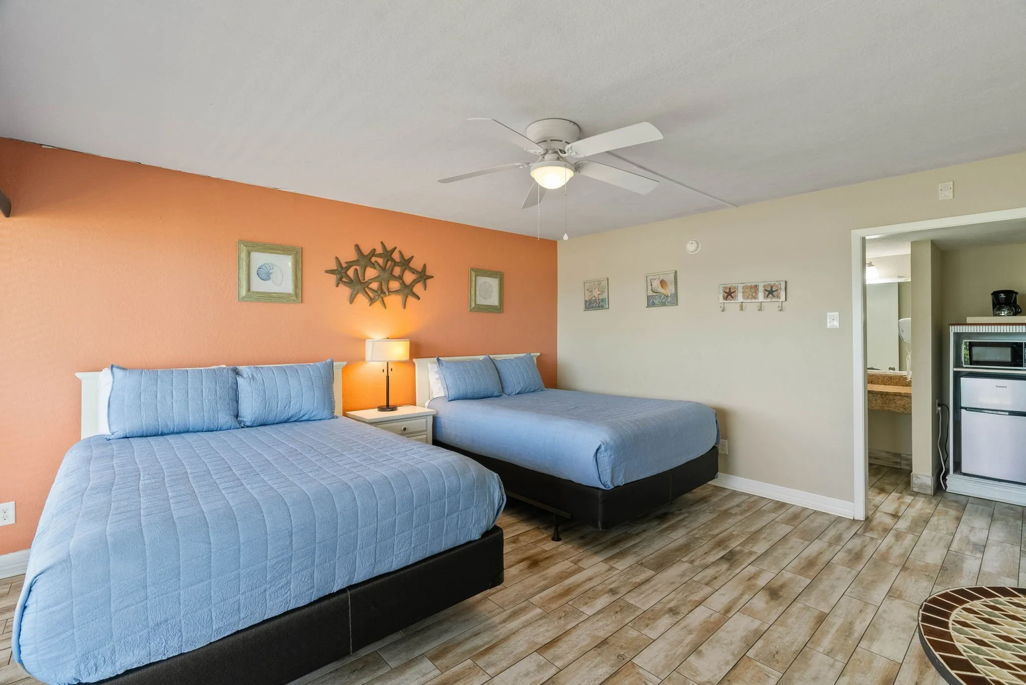 Coastal bedroom with two queen beds and beach-inspired decor at Rockport Retreat, Laguna Reef Condos