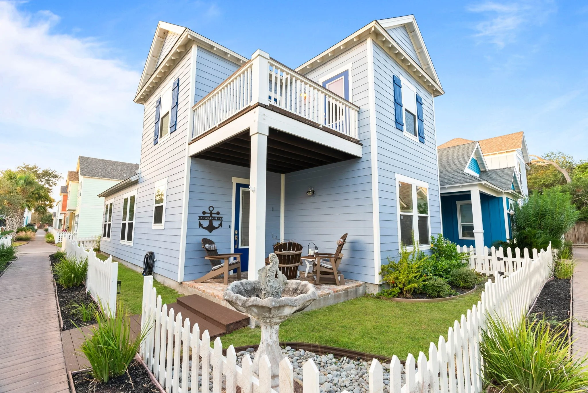 Two-story Marina Del Rey Rockport vacation home with balcony, garden, and fountain