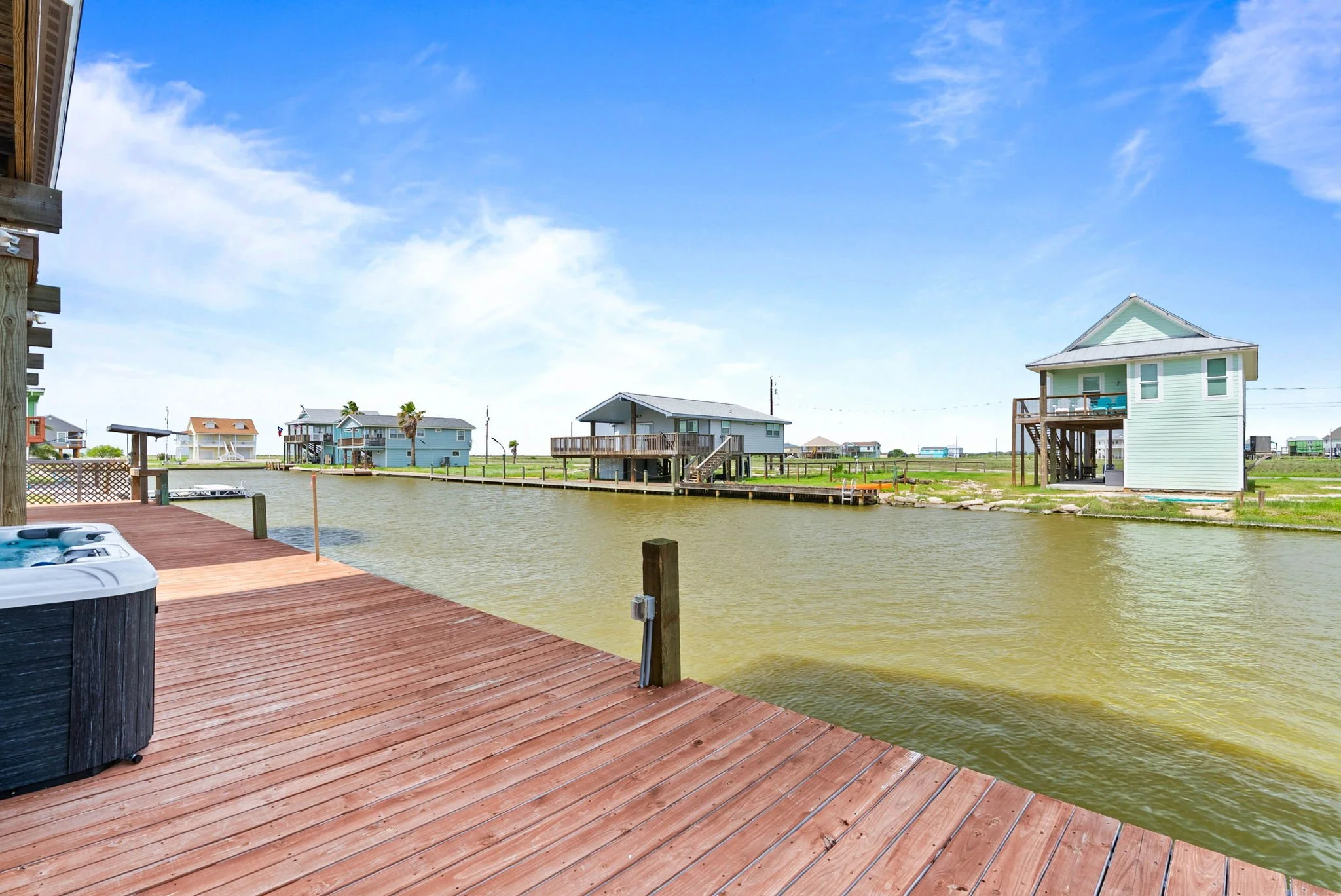 Spacious canal-side deck with direct waterfront access at a Rockport TX vacation rental