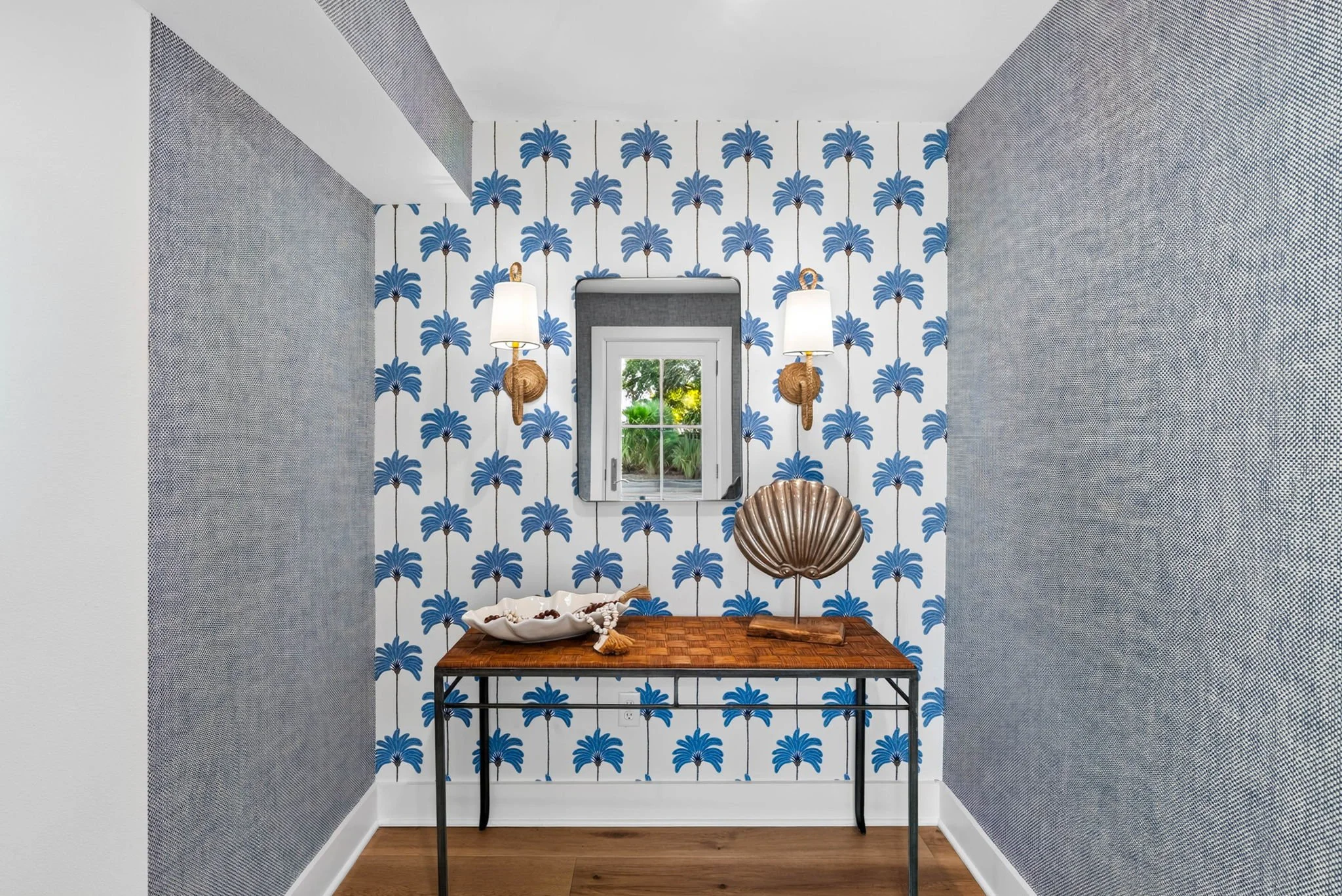 Designer entryway with coastal wallpaper in George's Landing luxury Rockport TX vacation rental 