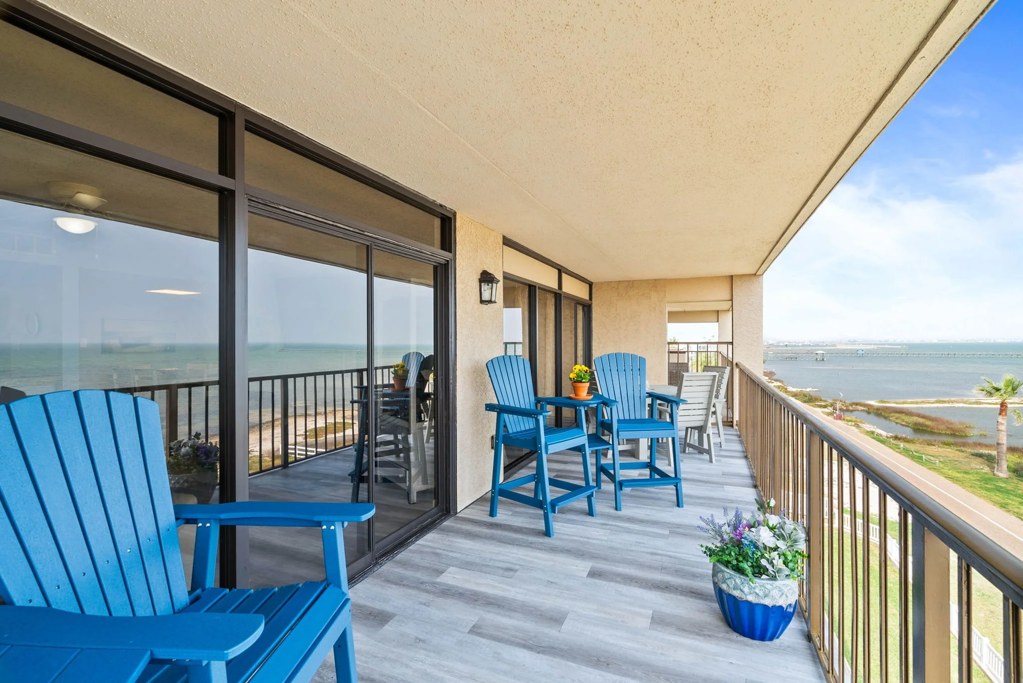 Spacious bayfront balcony with outdoor seating at Dayspring Unit 402 Laguna Reef Rockport TX