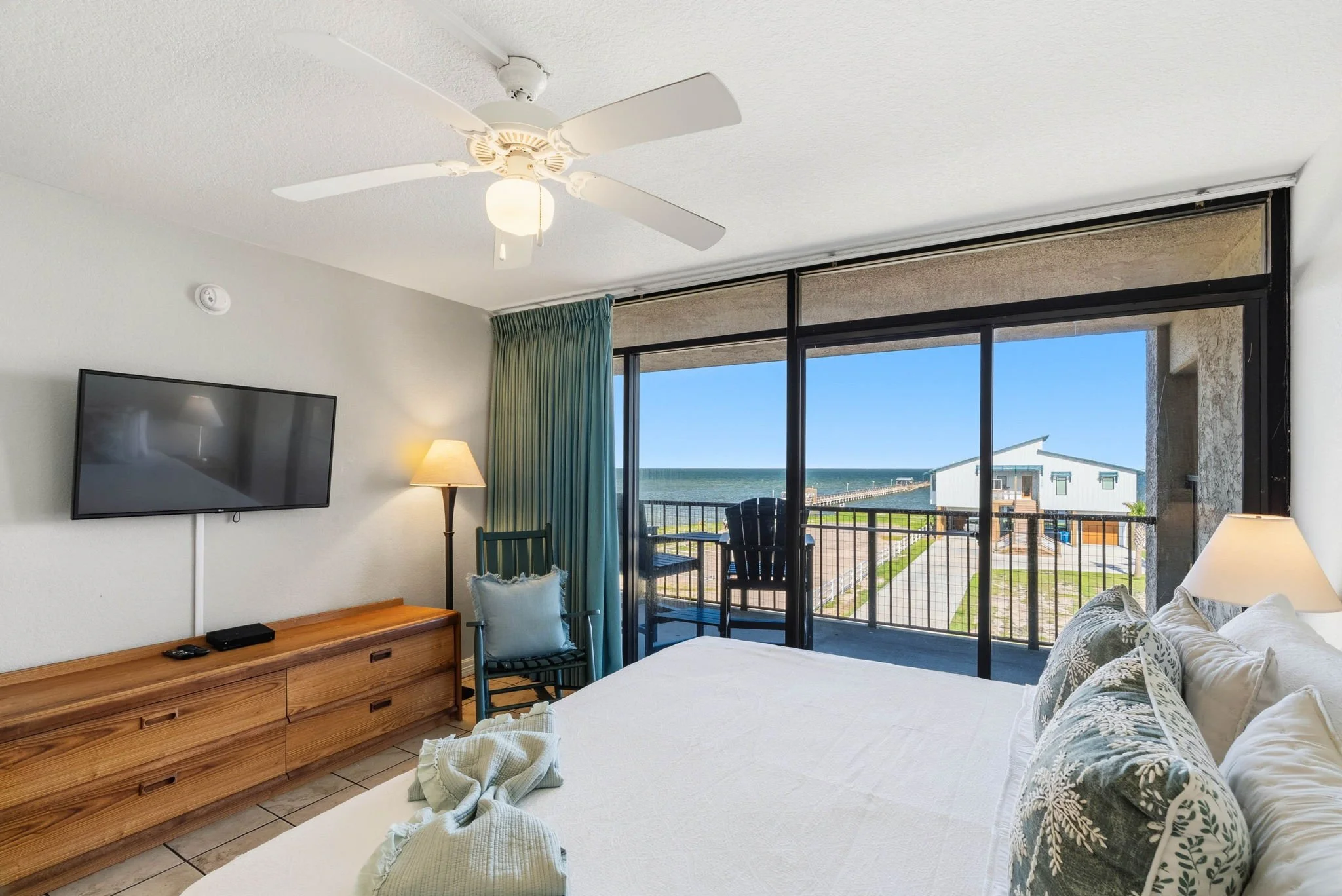 Spacious king suite with bayfront balcony views at luxury Rockport TX vacation rental
