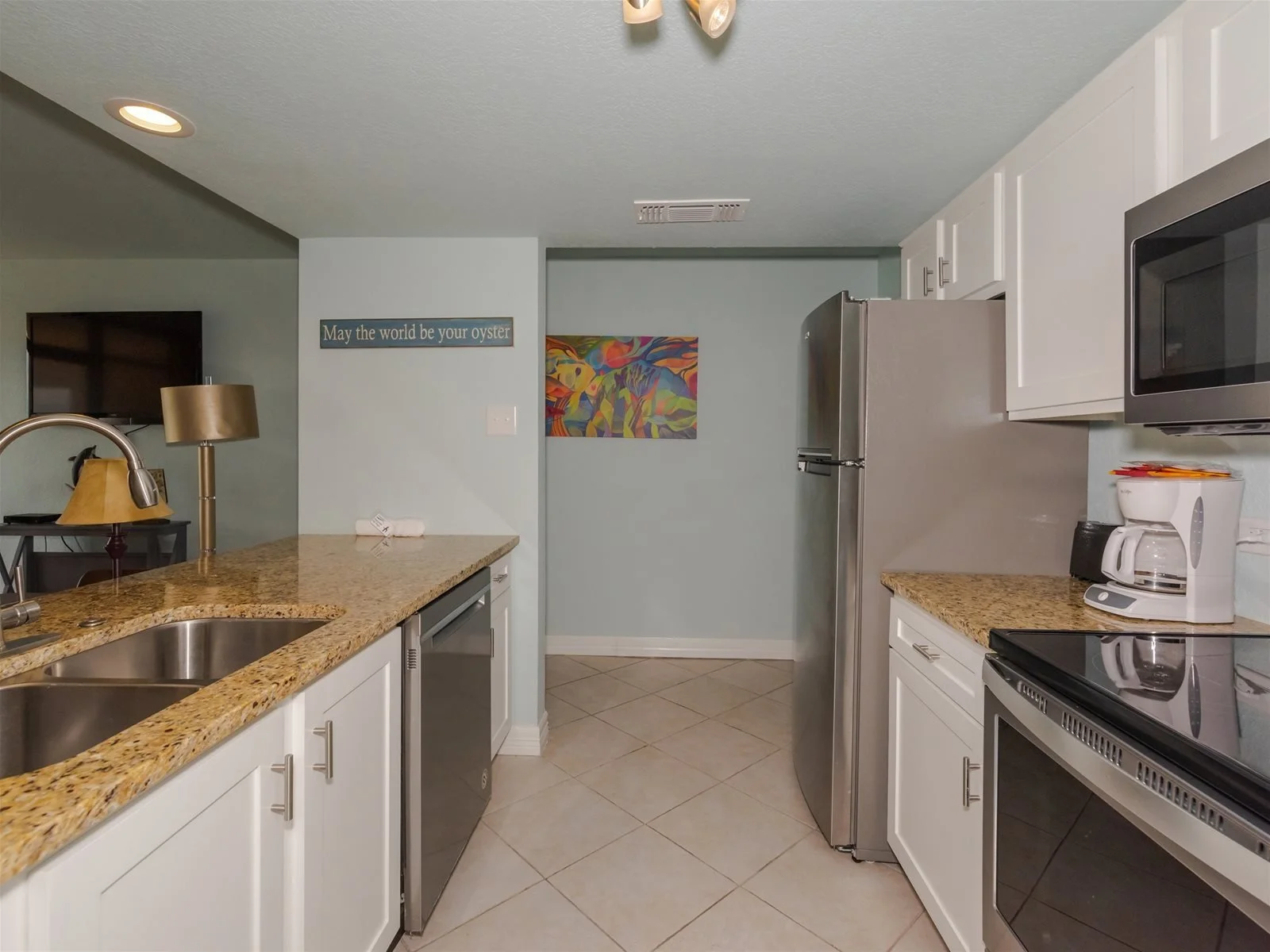 Fully equipped kitchen with stove, microwave, and refrigerator – Tradewinds vacation rental Rockport