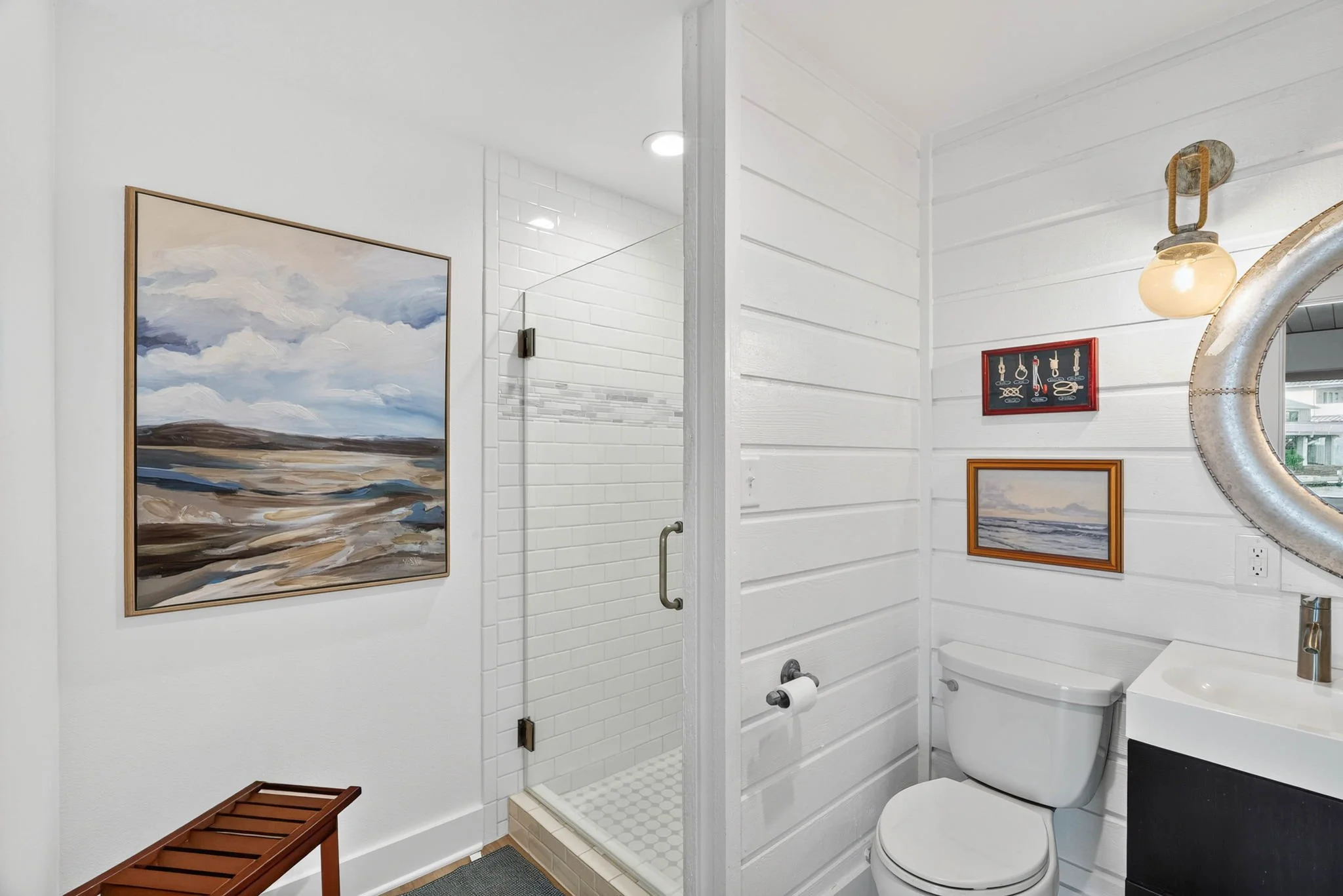 Bright downstairs bathroom with walk-in shower at George's Landing waterfront vacation rental 
