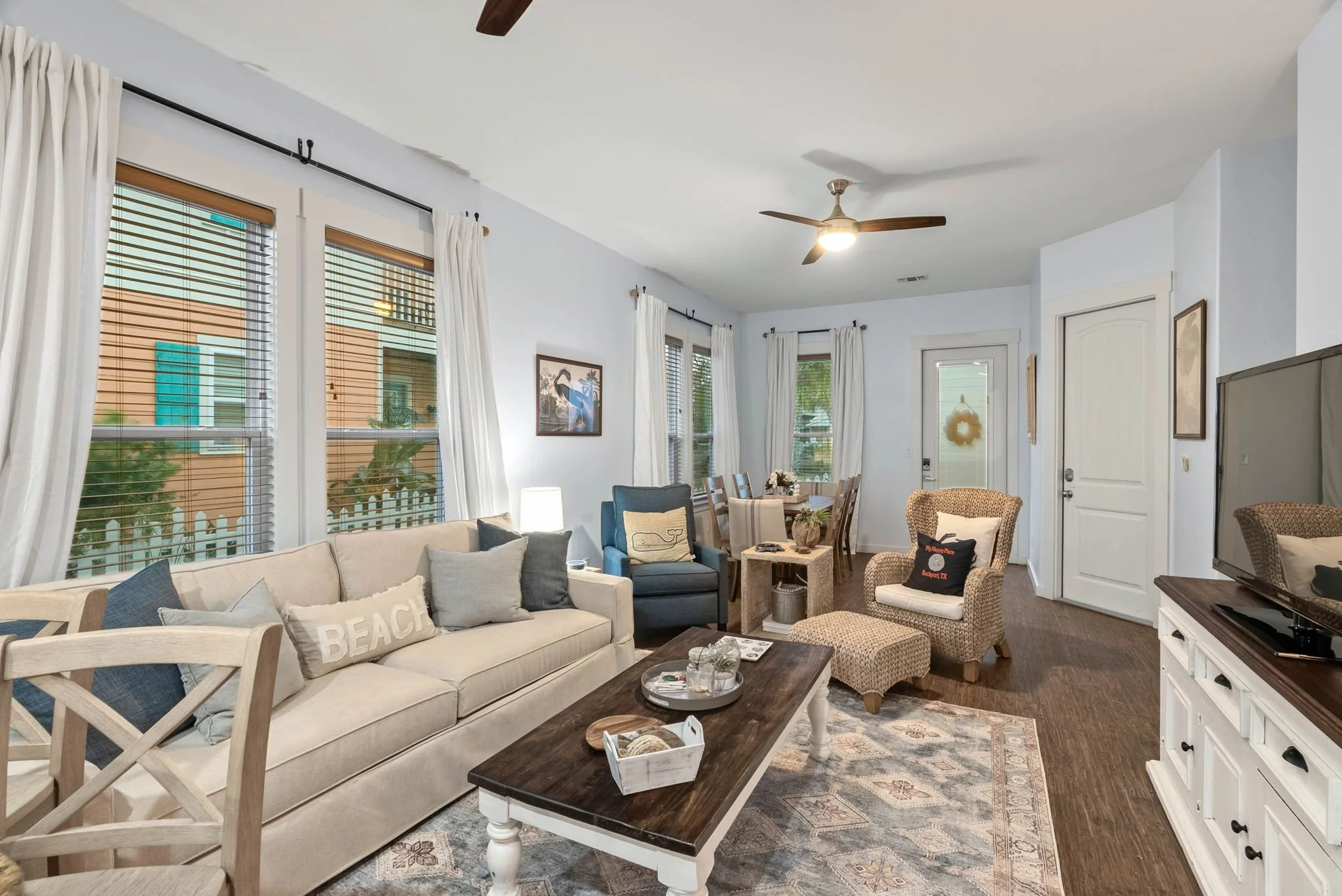 Open-concept living room in Marina Del Rey Rockport TX rental with coastal decor and family seating