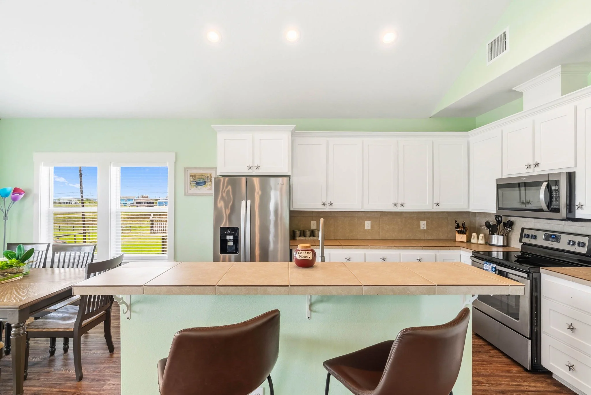 Spacious coastal kitchen with stainless appliances at Castaway Cottage vacation rental.