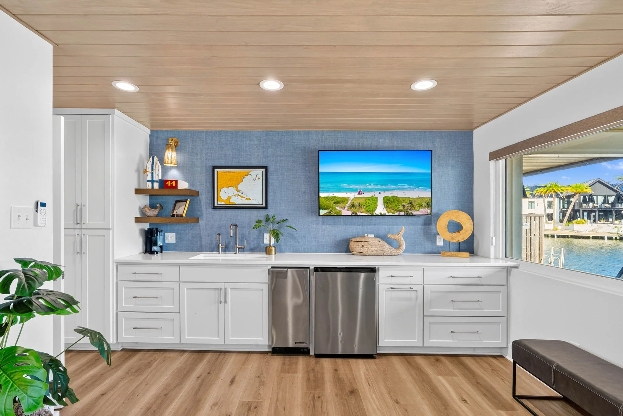 Modern wet bar with beverage fridge and ice maker in luxury Rockport TX waterfront vacation rental