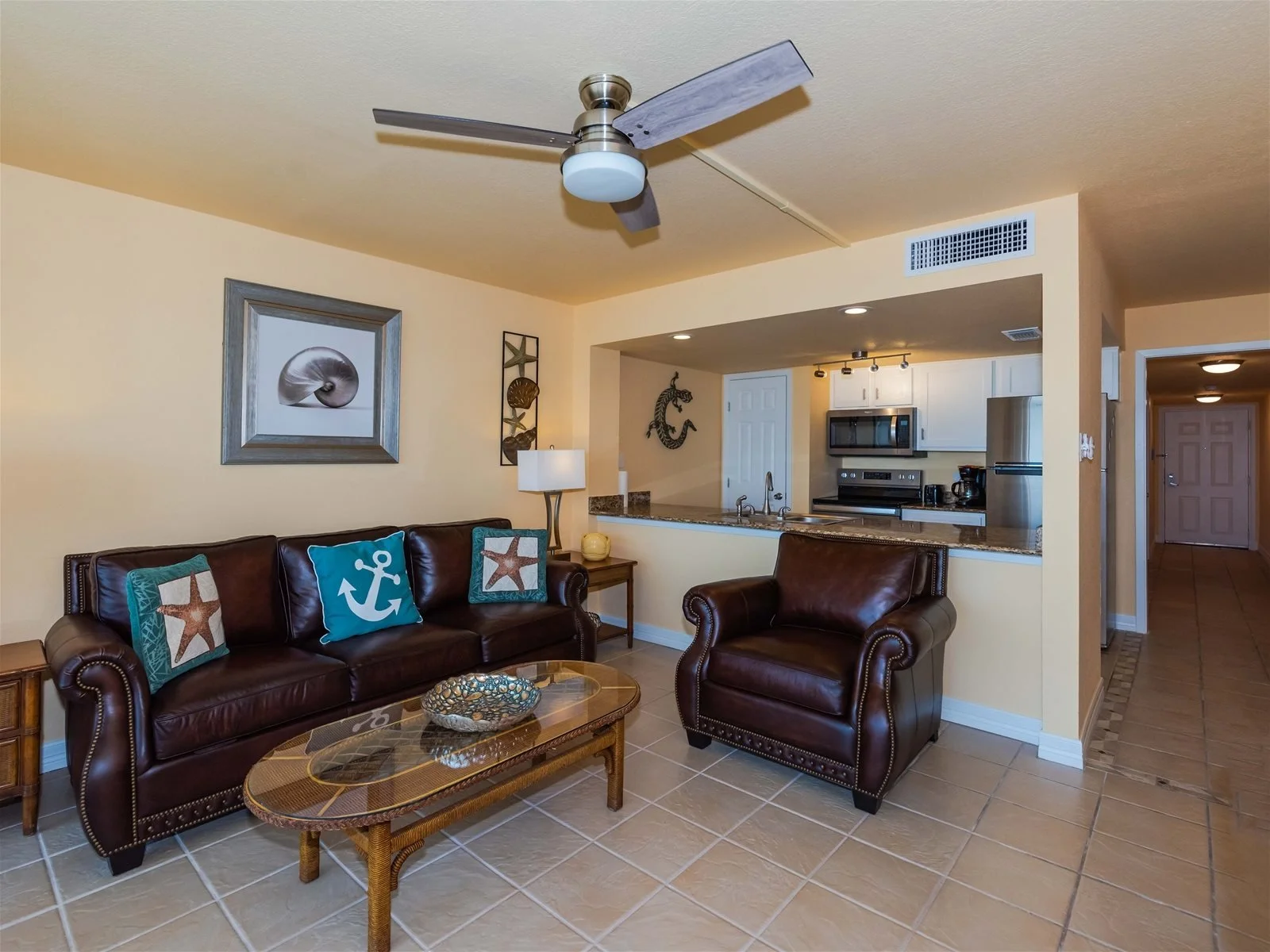 Living room with comfortable seating and balcony access – Paradise condo Rockport