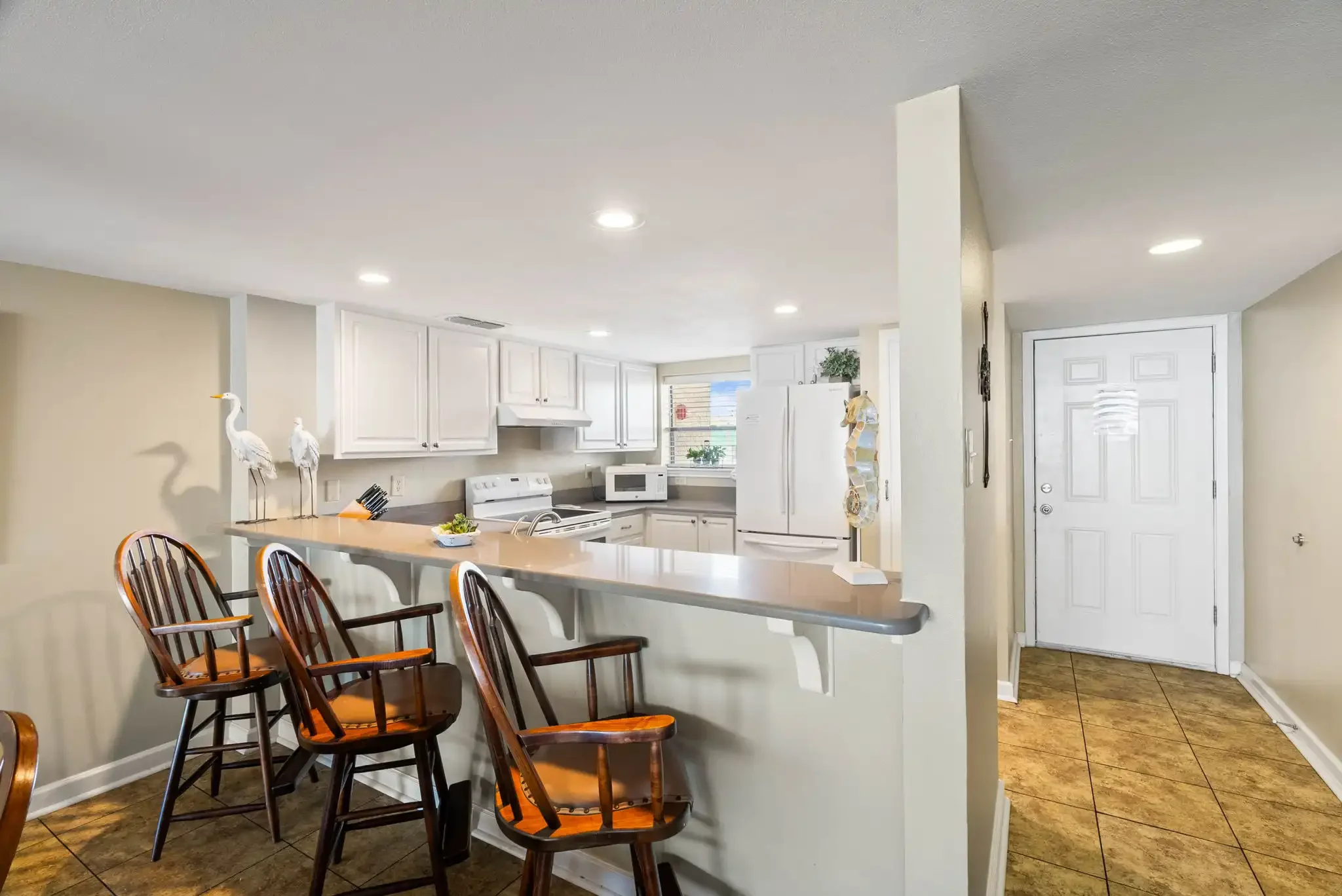 Fully equipped kitchen with stove, microwave, and refrigerator –Cool Runnings vacation rental Rockport