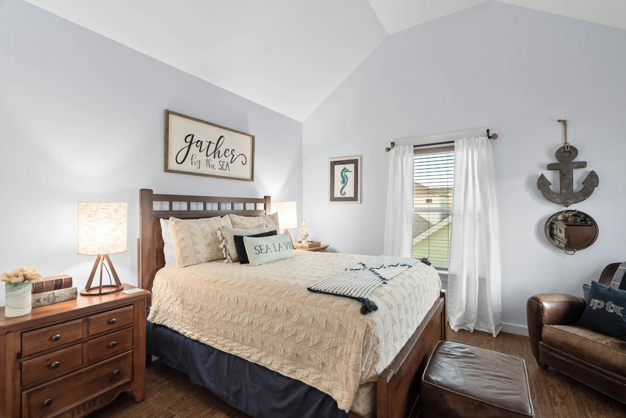 Coastal-inspired guest bedroom with queen bed and natural light at Marina Del Rey vacation rental in Rockport TX