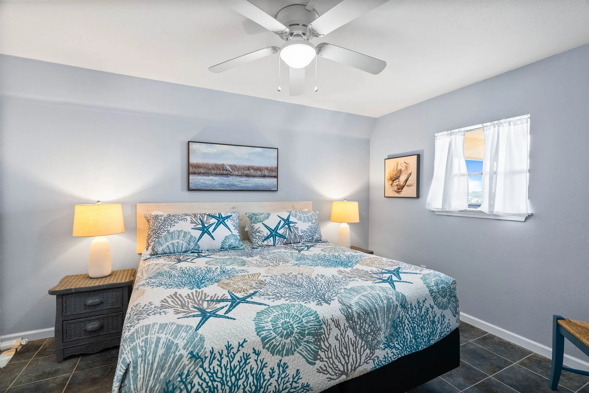 Guest bedroom with coastal bedding and nightstands at Dayspring 402 Laguna Reef Rockport TX