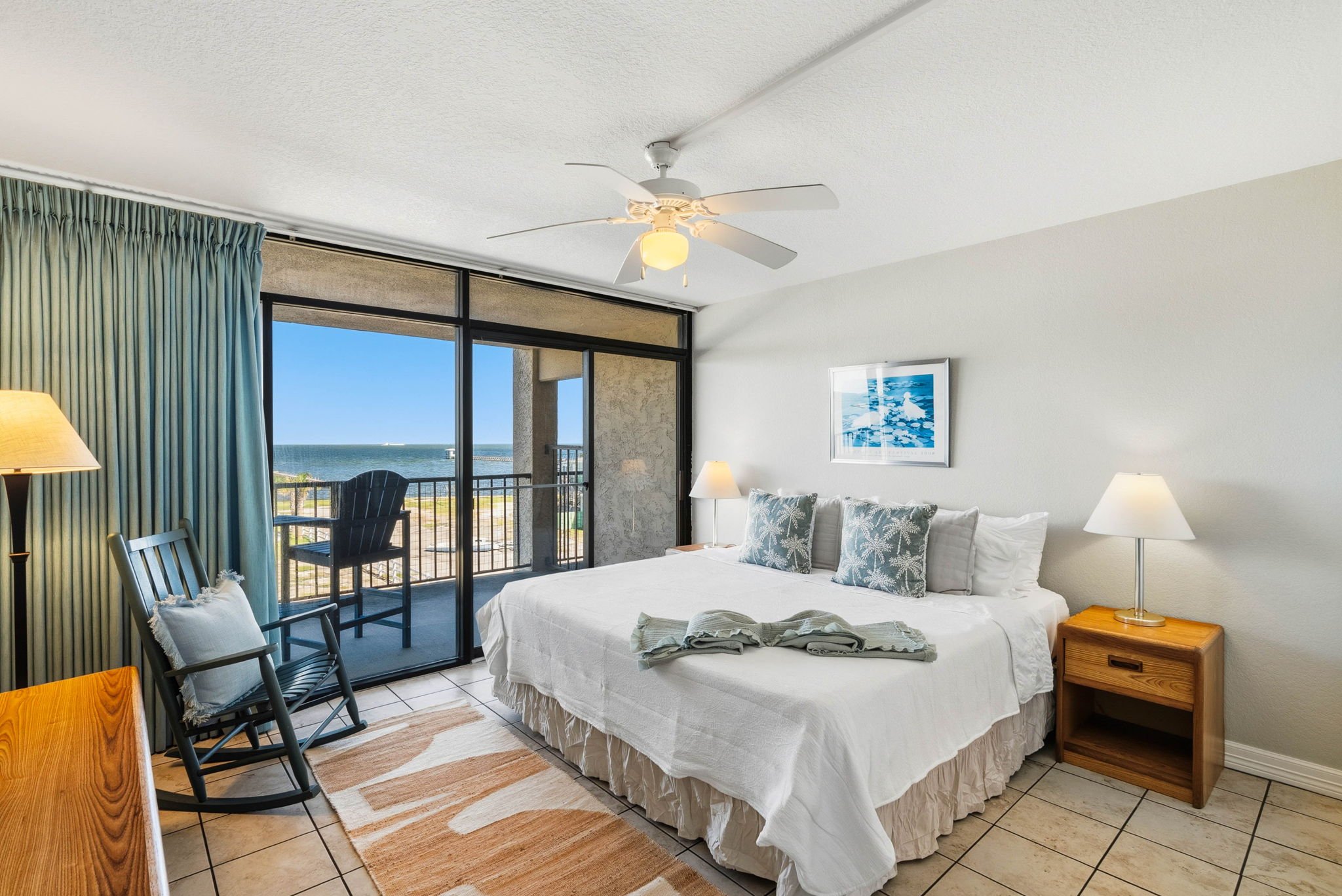Spacious king suite with bayfront balcony views at luxury Rockport TX vacation rental