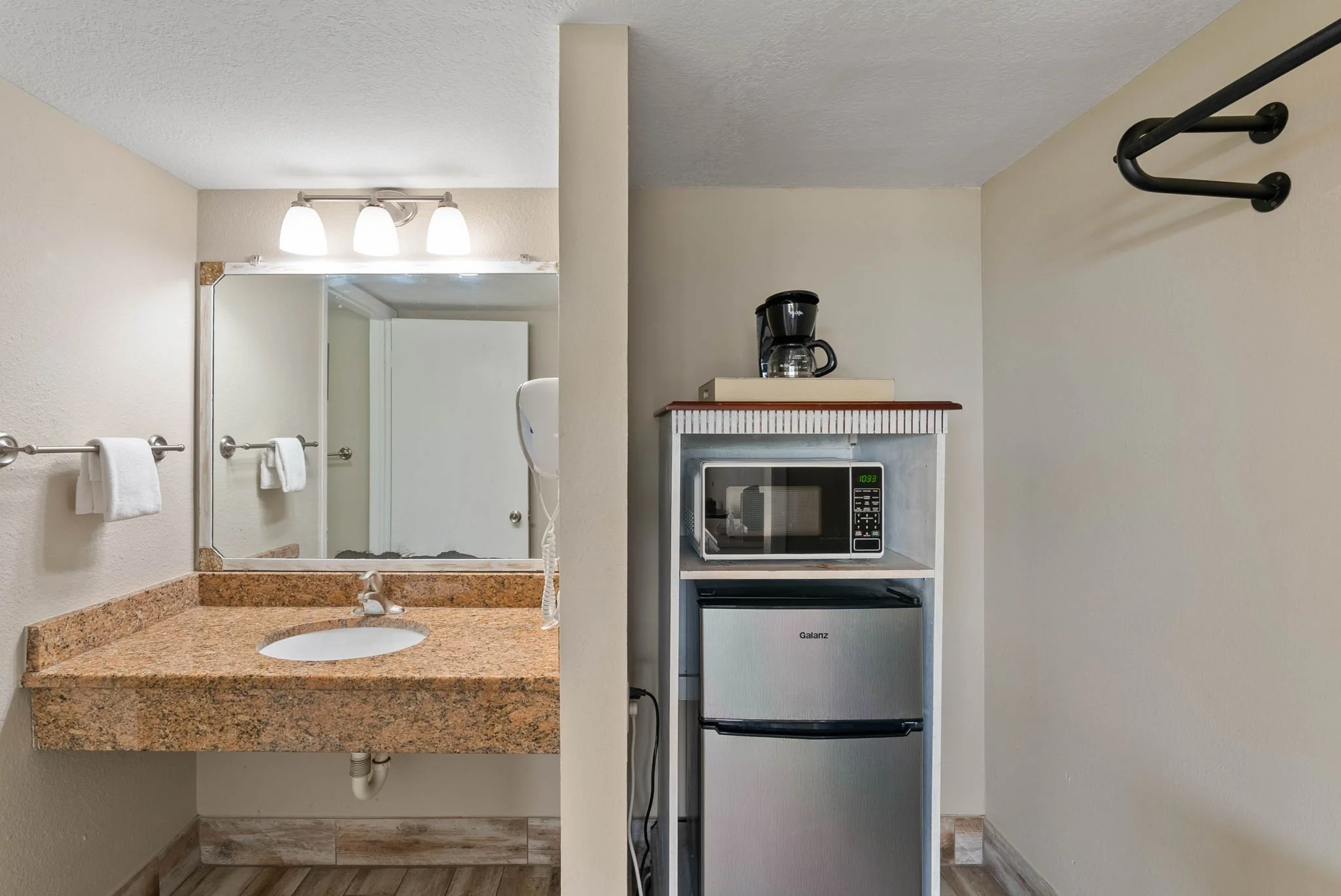 In-room vanity with mini fridge and microwave at Rockport Retreat, convenient coastal Rockport TX vacation rental