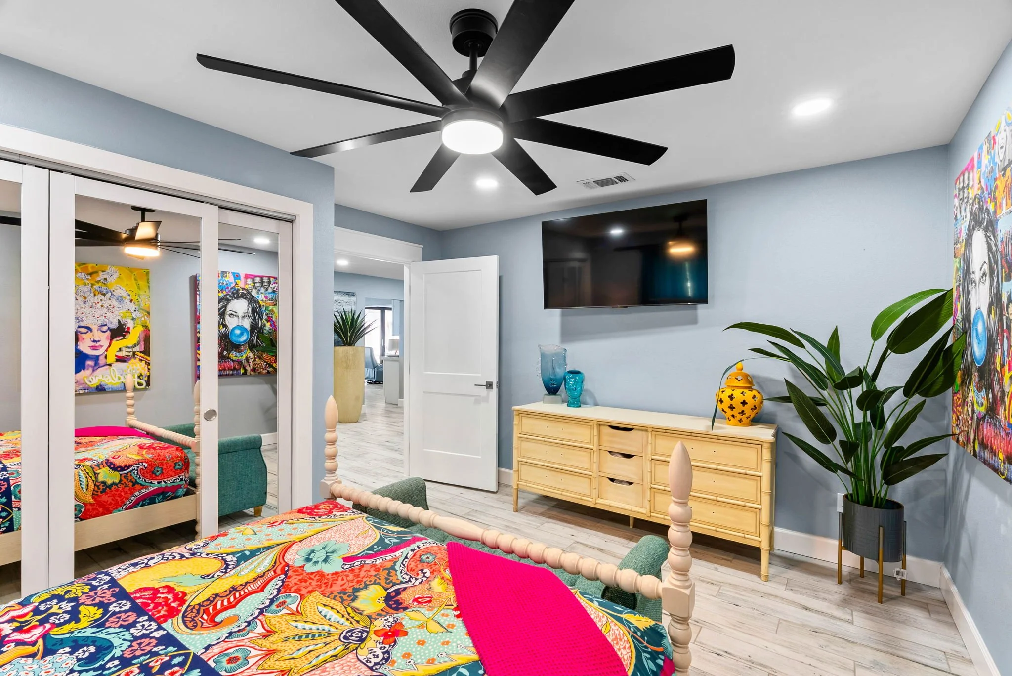 Bright coastal bedroom with smart TV and stylish furnishings in a luxury Rockport TX stay.