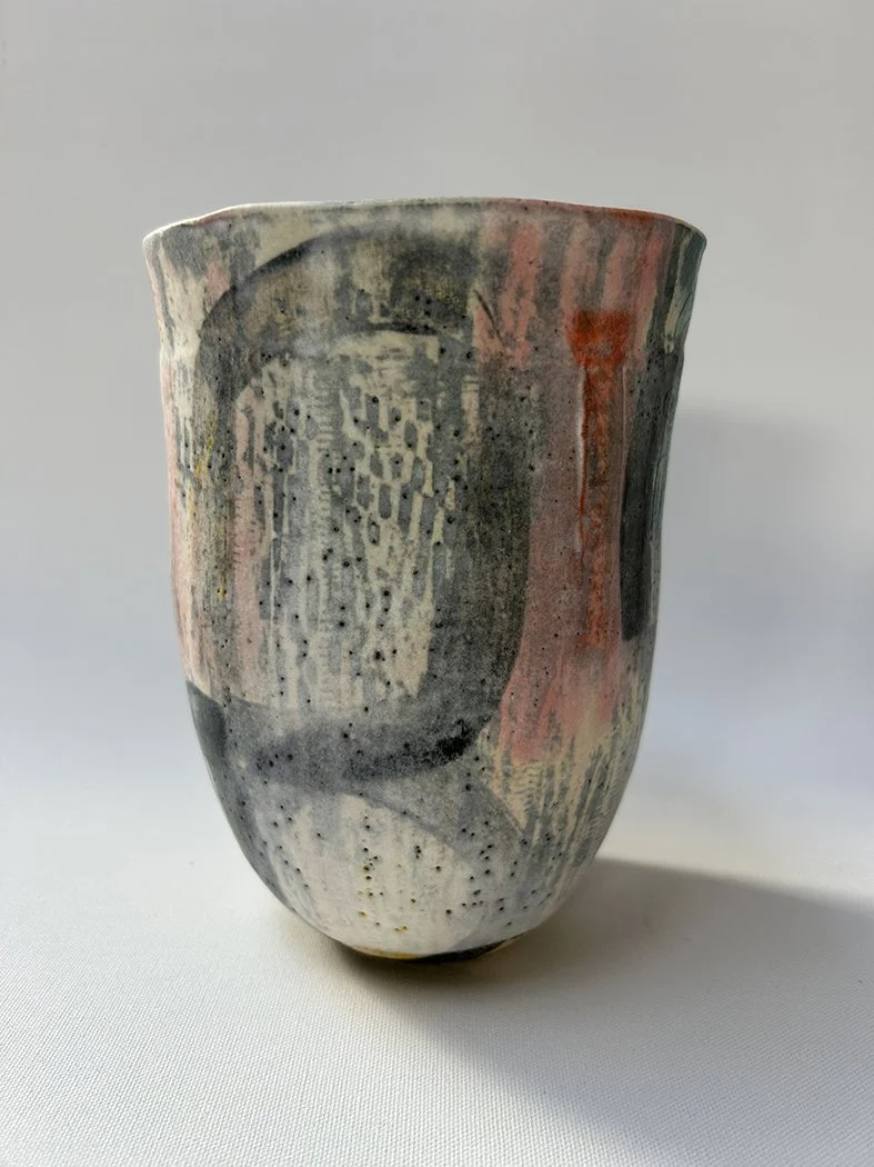  Sonny  
Coil built small vessel, carved surface texture and layering of underglaze.