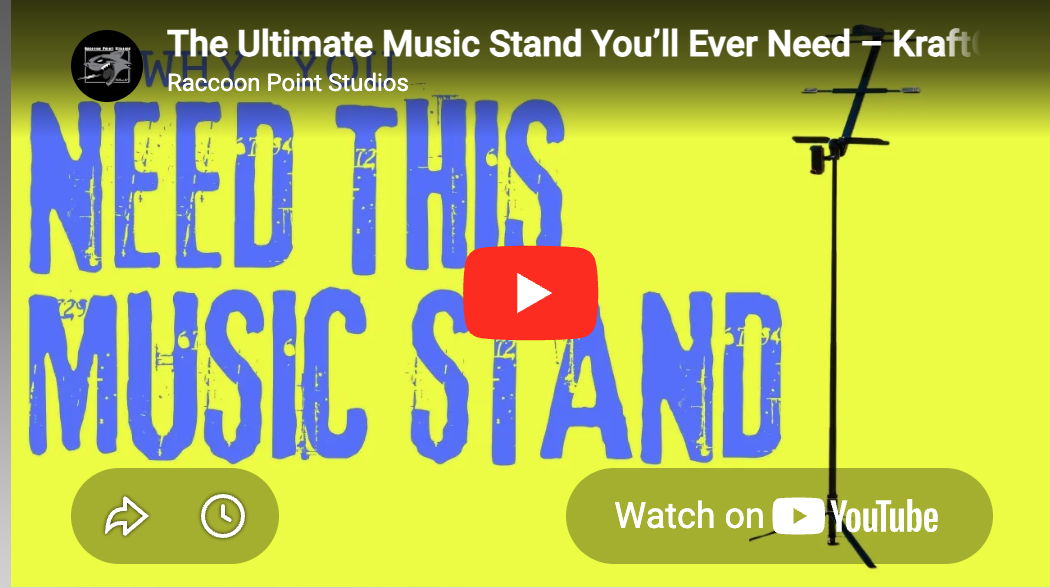 Bright yellow background with large blue distressed text saying 'Need This Music Stand'. At the top, white text reads 'The Ultimate Music Stand You'll Ever Need – Kraft Raccoon Point Studios'. To the right, there's an image of a black adjustable music stand. There are also icons for sharing, a clock, and a green button with 'Watch on YouTube' text.