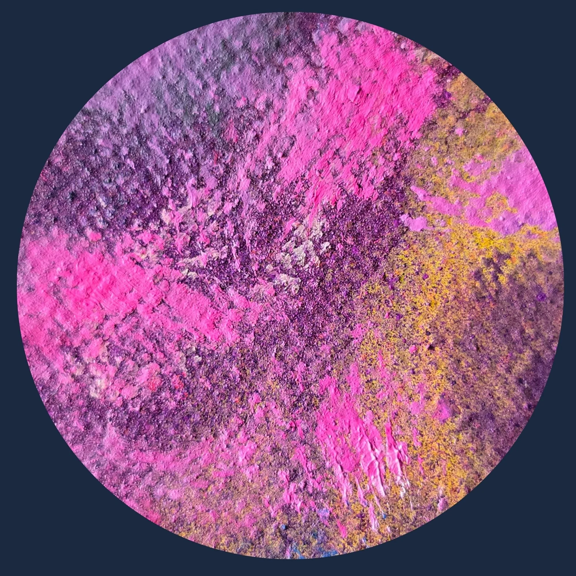 Close-up of a textured, circular abstract artwork with vibrant pink, purple, and yellow hues on a dark background.