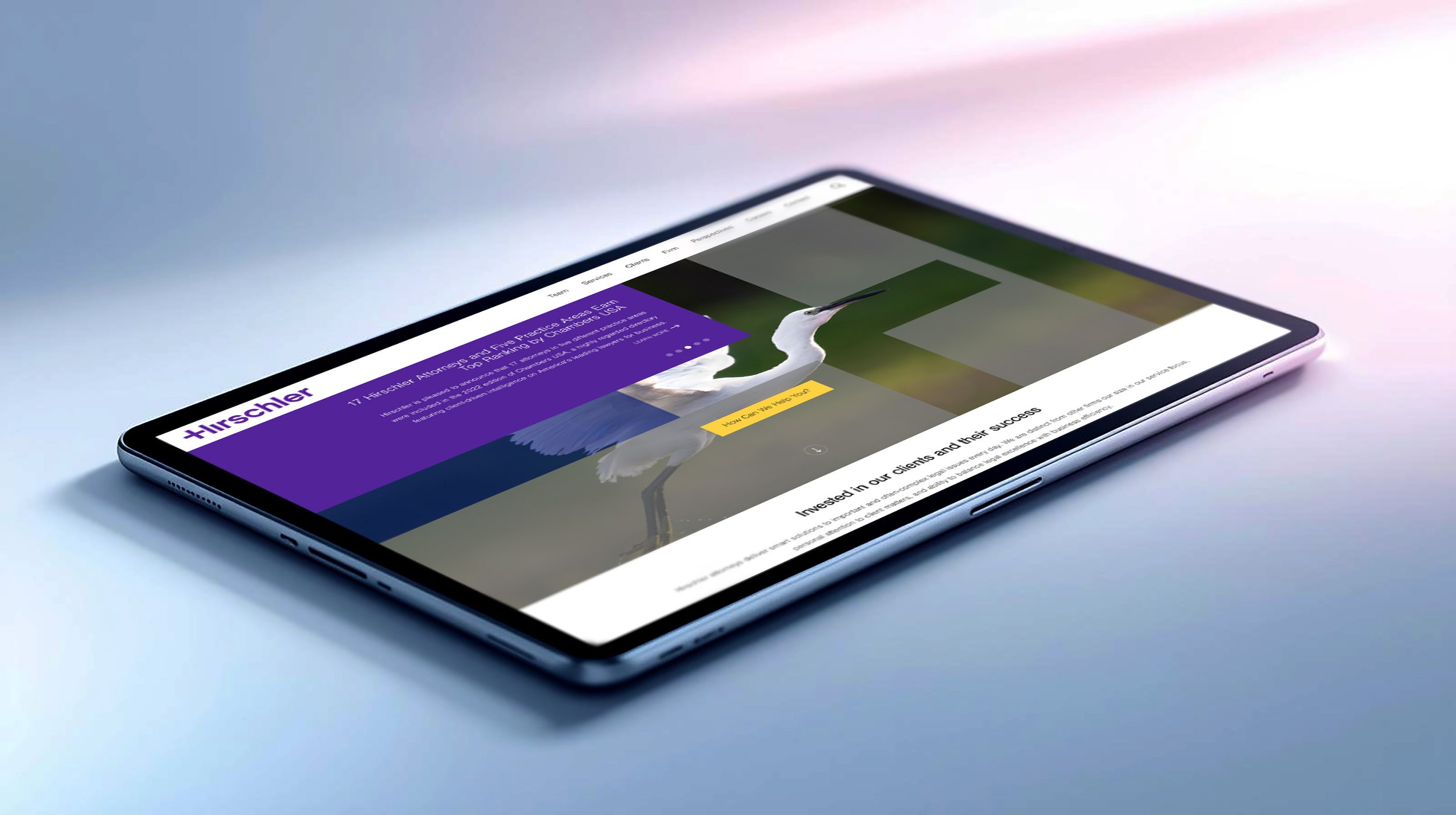 Tablet displaying Hirschler law firm website homepage with a purple-accented design and large hero image, shown on a soft gradient background.
