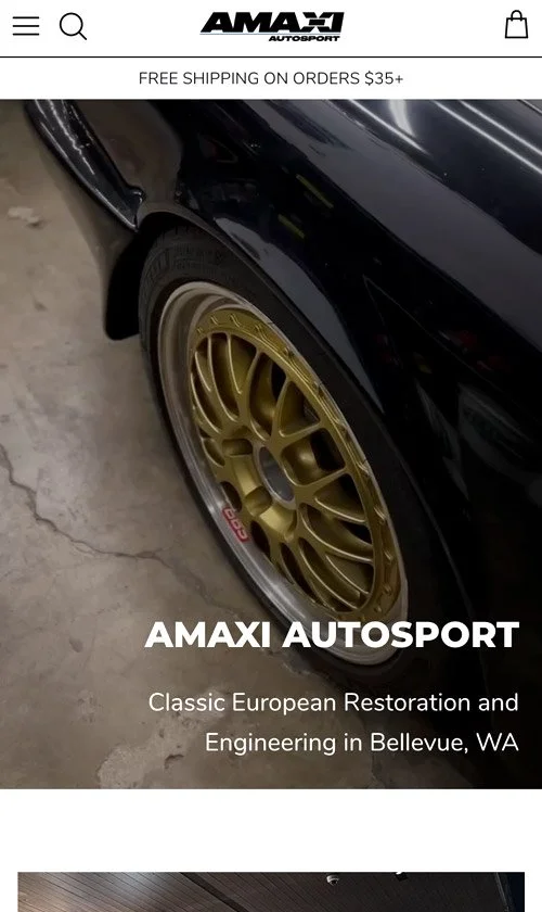 Mobile homepage of AMAXI Autosport highlighting the brand’s focus on classic European restoration and engineering with a close-up of a black car’s gold wheels.