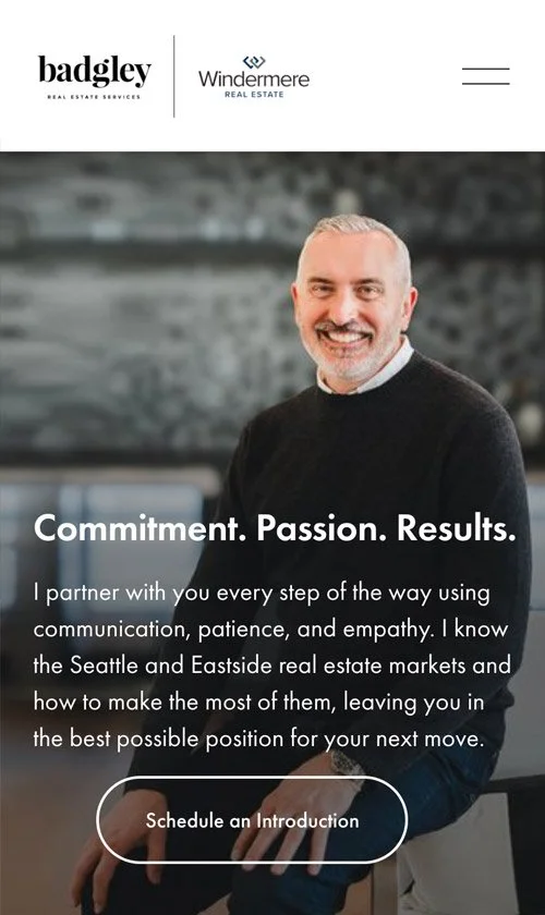 Mobile view of Badgley Homes website homepage with agent portrait and hero message.