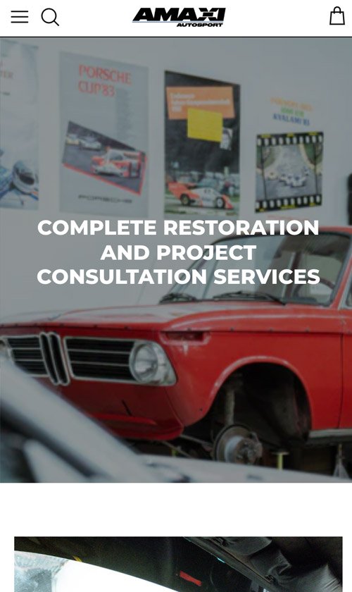 Mobile view of AMAXI Autosport restoration page featuring a red classic BMW under repair with text overlay promoting complete restoration and consultation services.