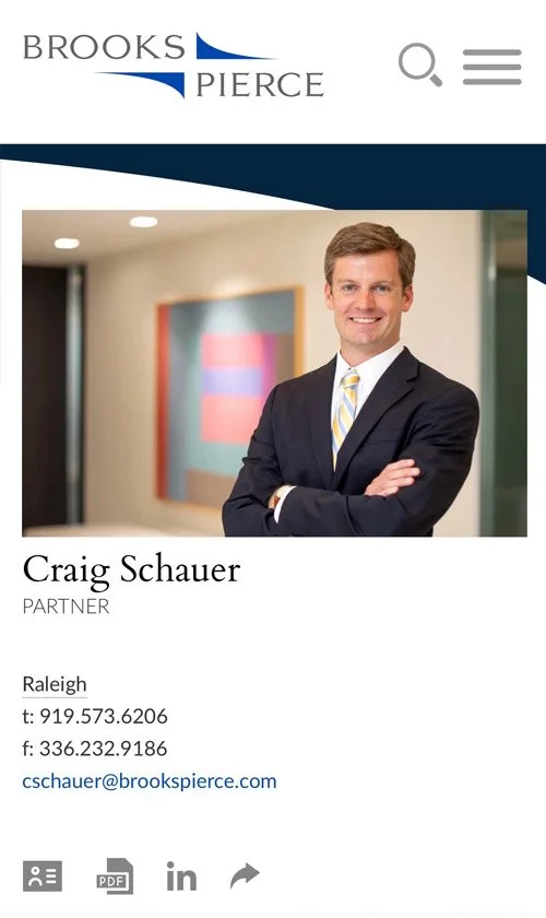 Mobile attorney profile for Craig Schauer, Partner at Brooks Pierce, featuring contact details and professional links.