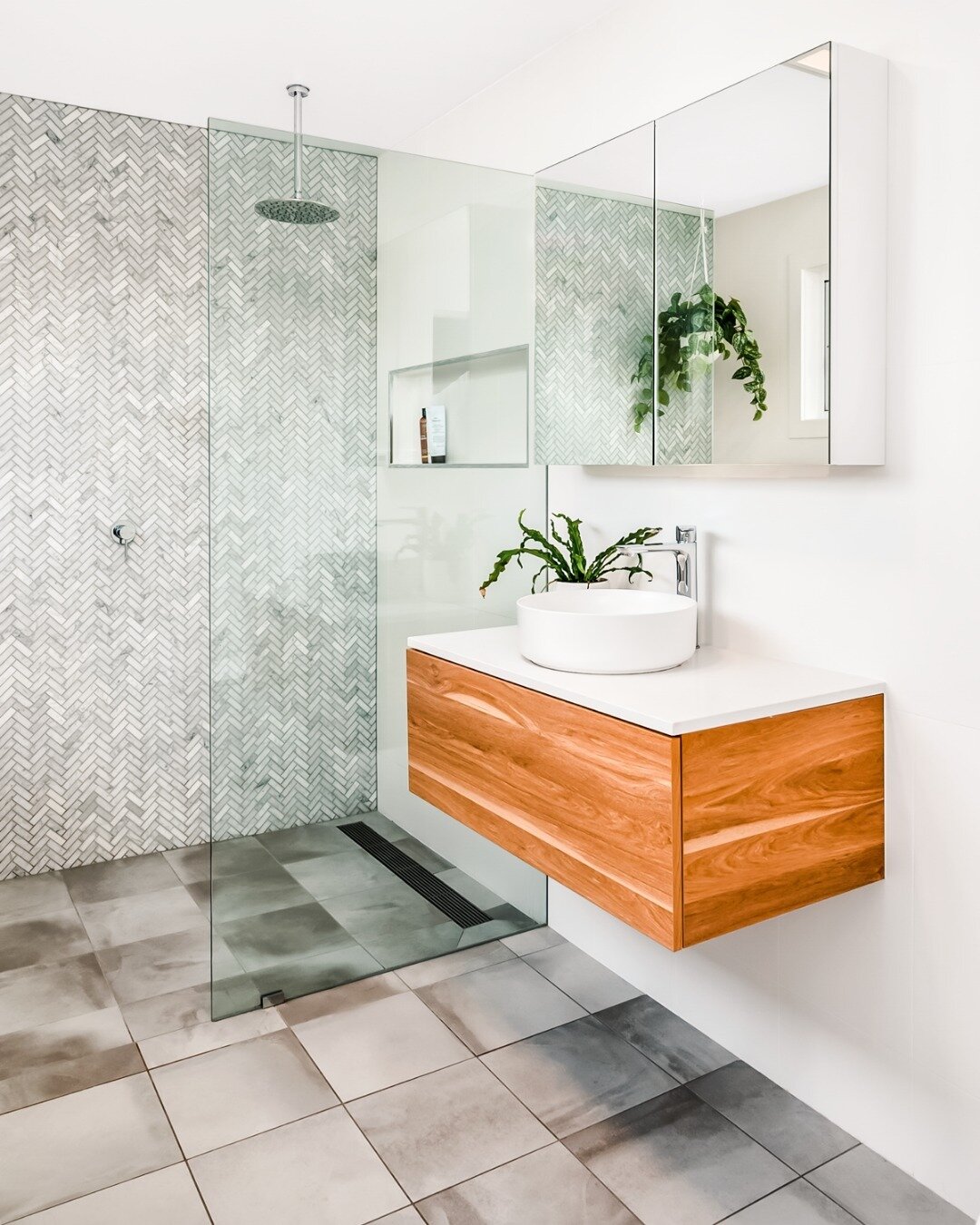 This is your sign to renovate your bathroom! 🌿🛁 

Our Medcalf St. Build's ensuite shower and bath still gives us major bathroom envy. With floor to ceiling herringbone tiles, floating vanity, and double sinks, this space screams luxury. And don't g