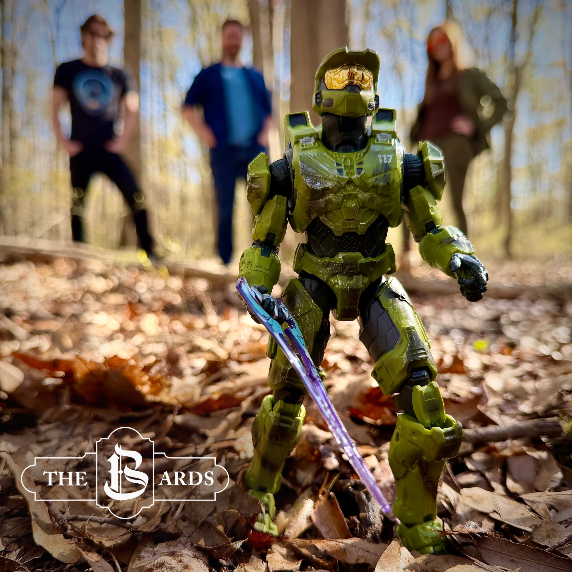 Master Chief from Halo stands in the foreground in front of John, Kevin, and Alyssa amongst trees and fallen leaves