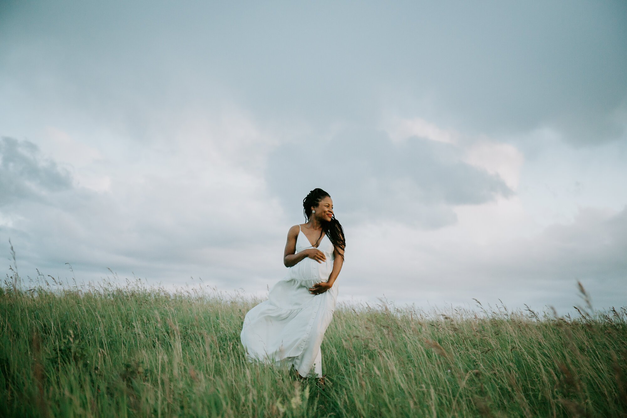  There’s so much I love about this photo - T’s expression on her face, the stormy skies behind, and her windswept dress. Everything came together perfectly. 