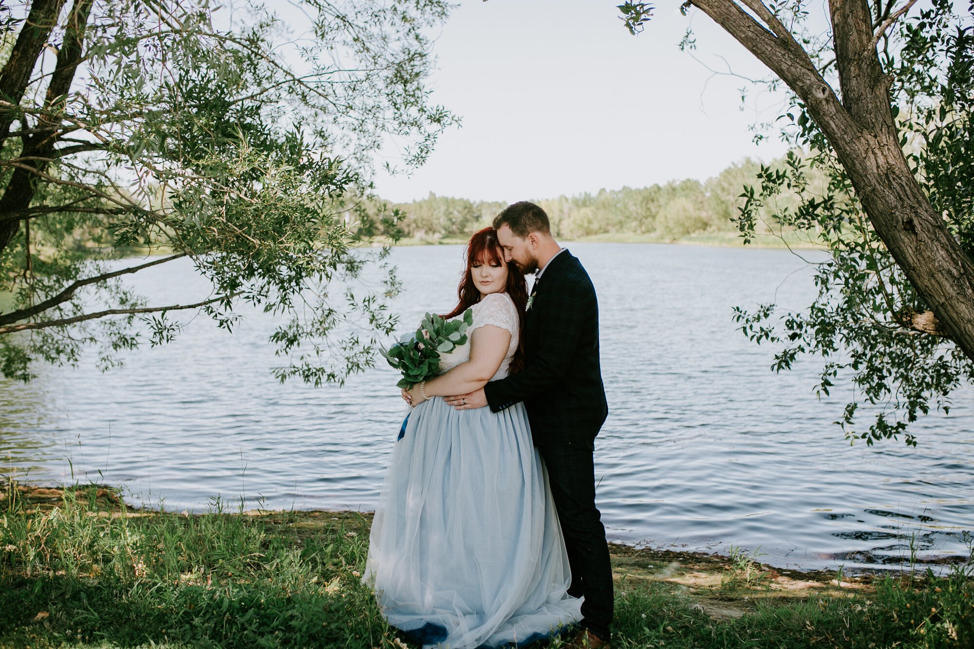  I chose this photo from C+C’s wedding day at Carburn Park as it was one of the last photos we got from the day.  I love that in this moment, it feels like they’ve forgotten I’m even there (plus those tones in the water - obsessed).  
