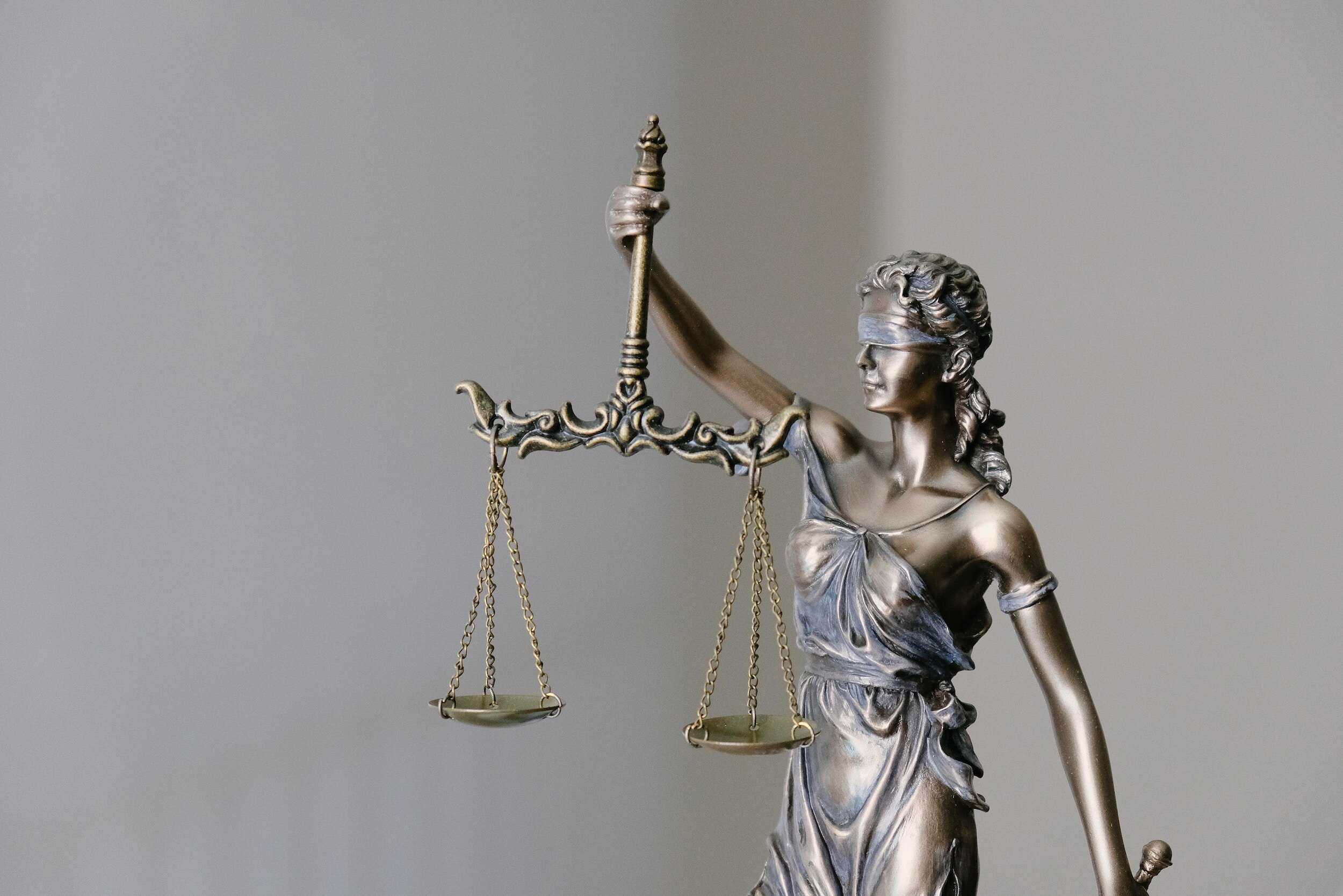 This is a photo of a bronze figure of Lady Justice representing legal services provided by Leelanau Peninsula Chamber members