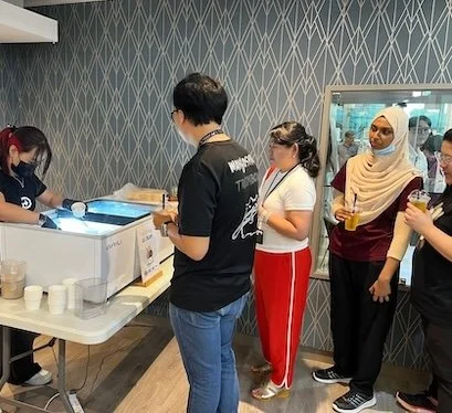 scooped ice cream live station ice cream cup variety of flavours custom cups stickers ice cream bar catering event singapore wedding corporate road shows live experience