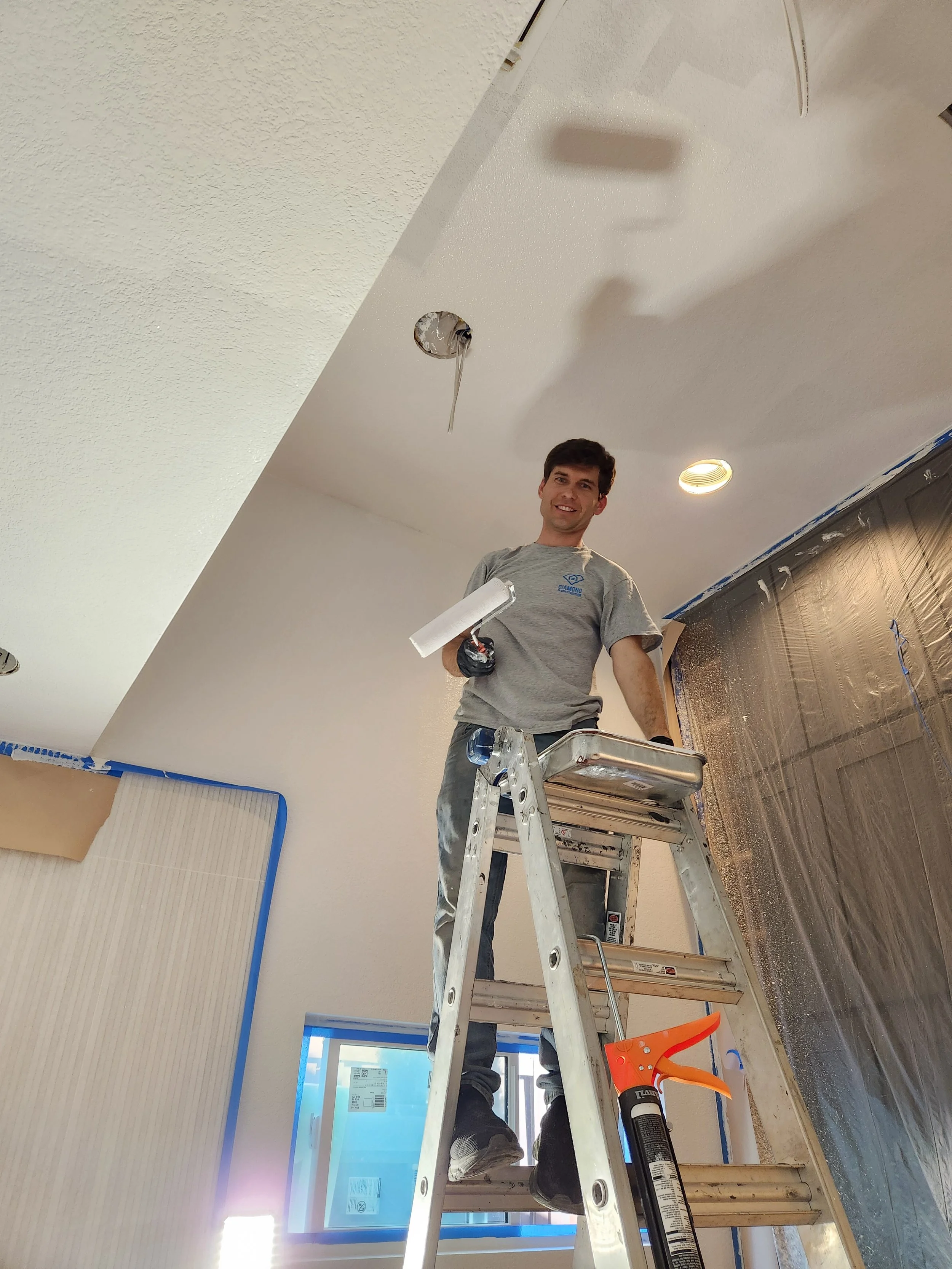 Paul painting the bathroom with some lighter colors