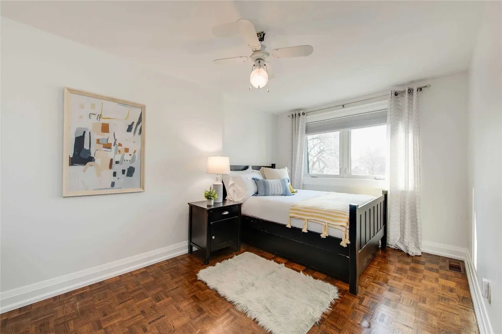 North Central Toronto bedroom by First Place Homes: white walls and a refinished wood floor