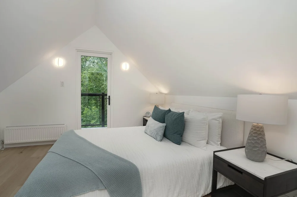 High Park three storey addition by First Place Homes: bedroom under the new roof