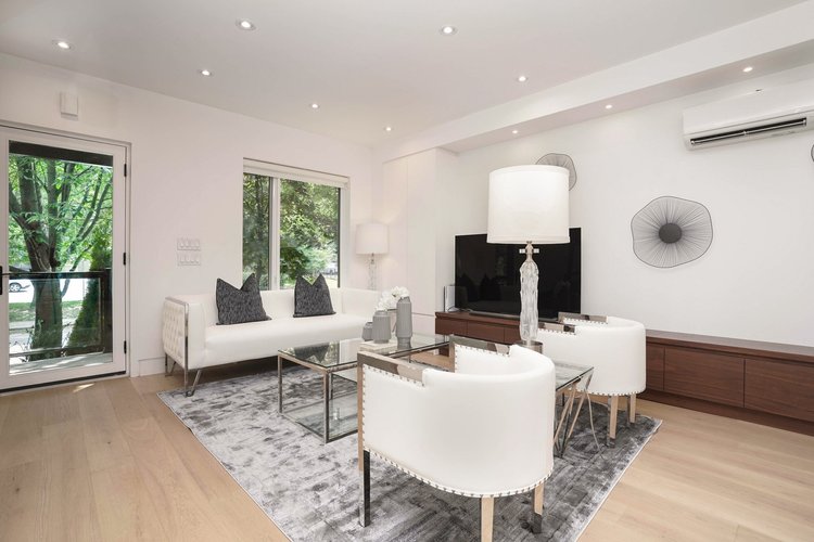 High Park three storey addition by First Place Homes: living room opening to the kitchen