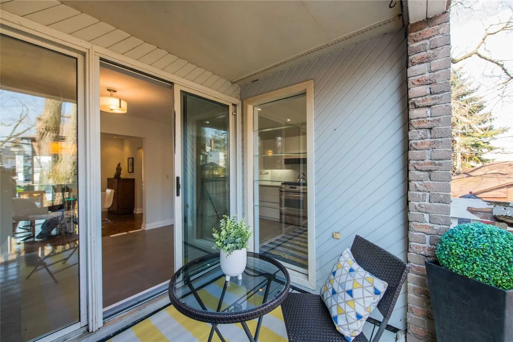 North Central Toronto home renovation by First Place Homes: new sliding doors seen from the deck