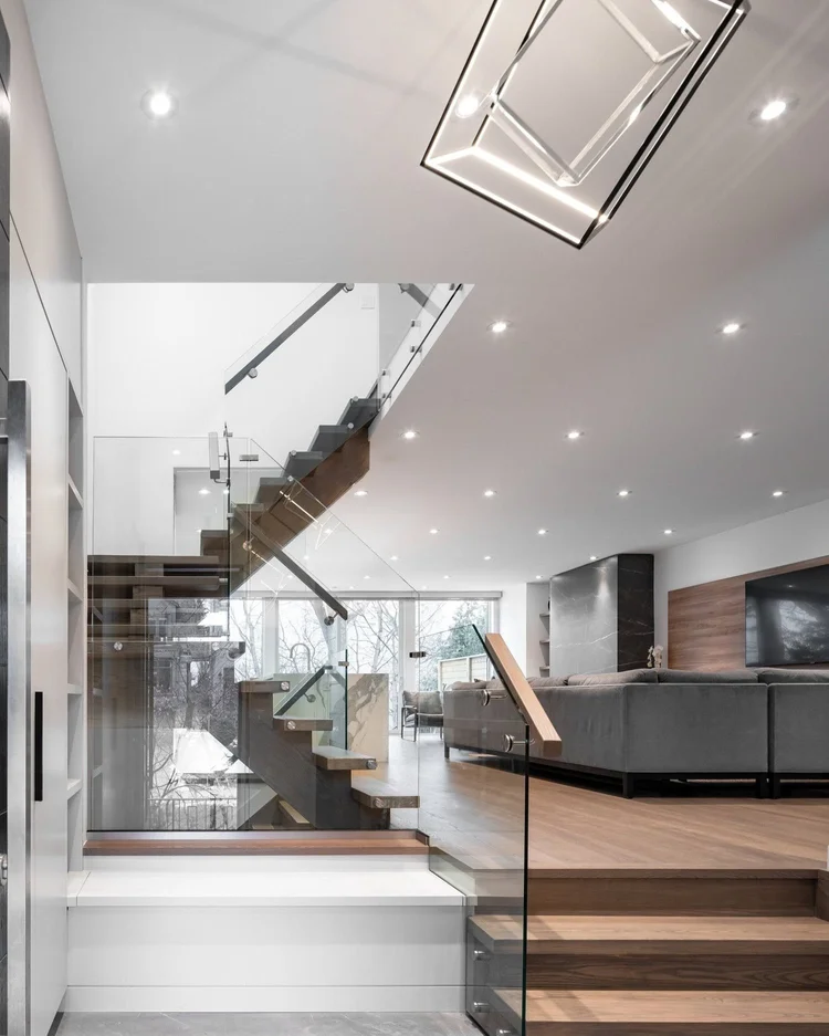 West side Toronto main floor renovation by First Place Homes: oak stair with glass railing