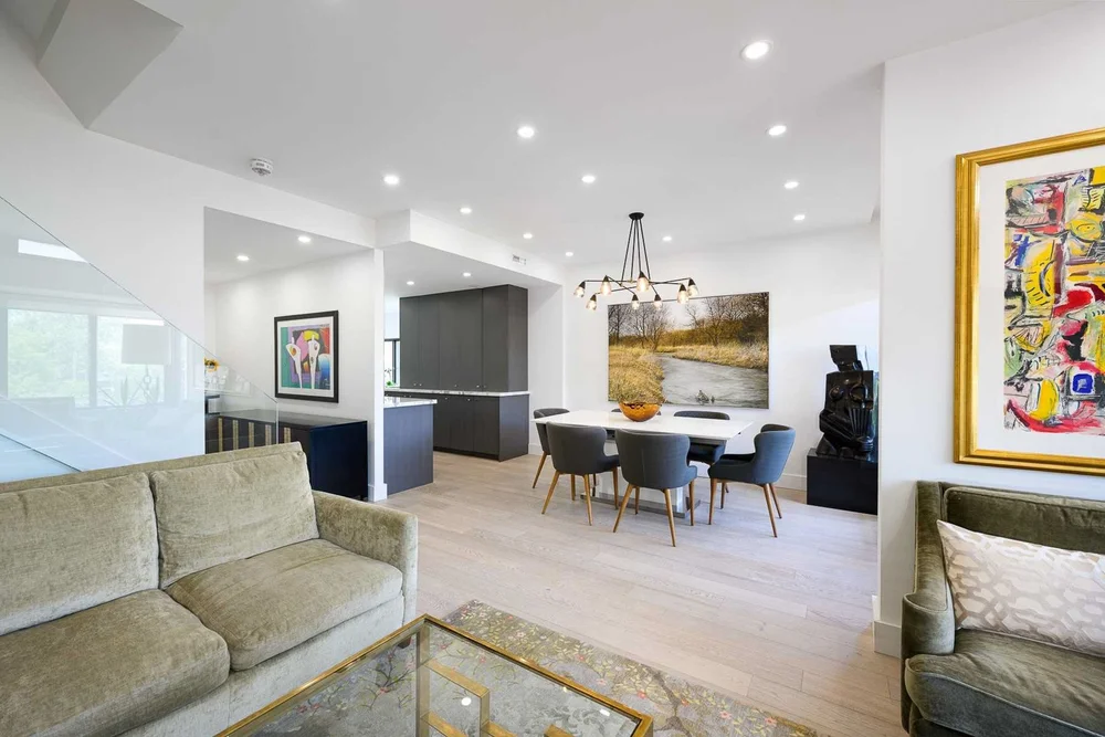 Toronto townhome renovation by First Place Homes: living and dining room with built-in shelving