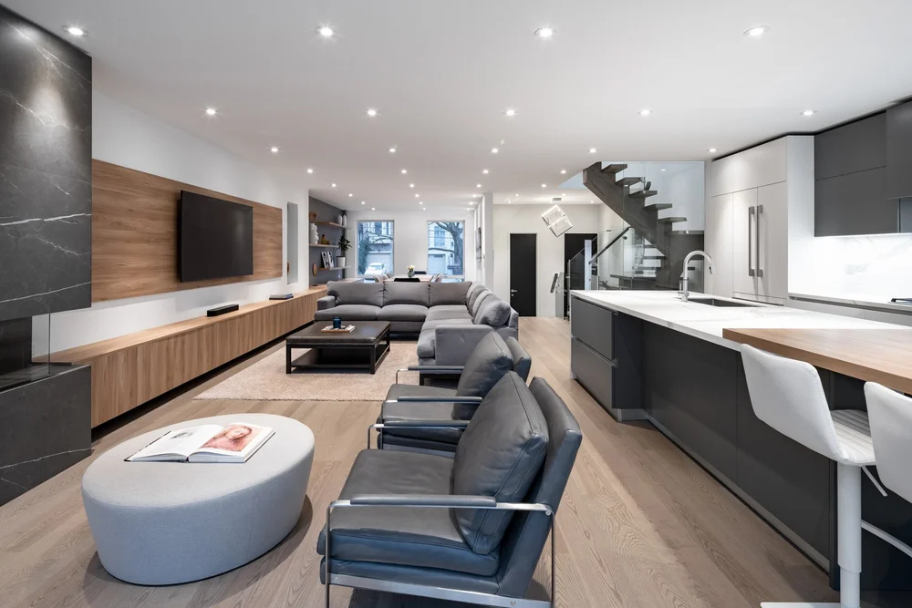 West side Toronto open concept renovation by First Place Homes: living room looking through to the kitchen