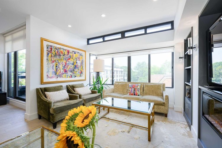 Toronto townhome living room renovation by First Place Homes: built-in shelving and clerestory windows