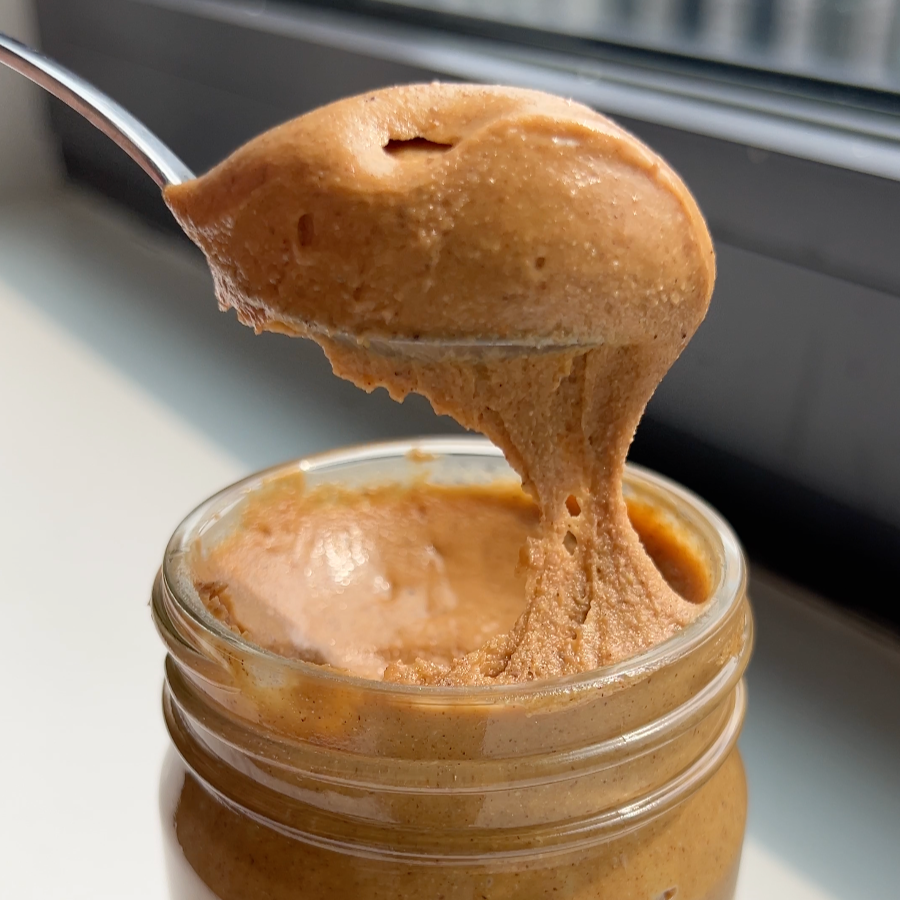 A spoon full of baklava flavored nut butter