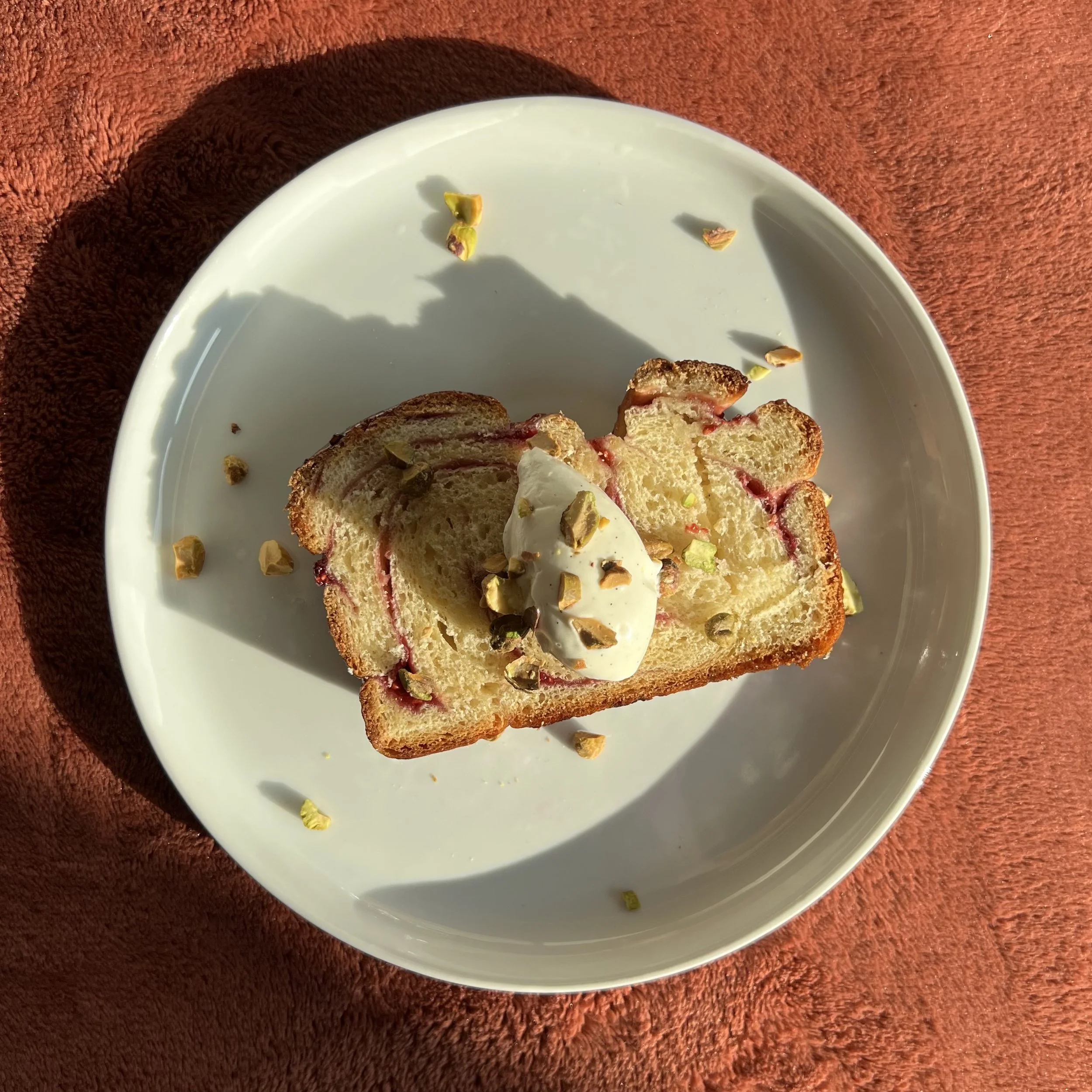 Raspberry Jam Babka with Vanilla Bean Pistachio Whipped Cream