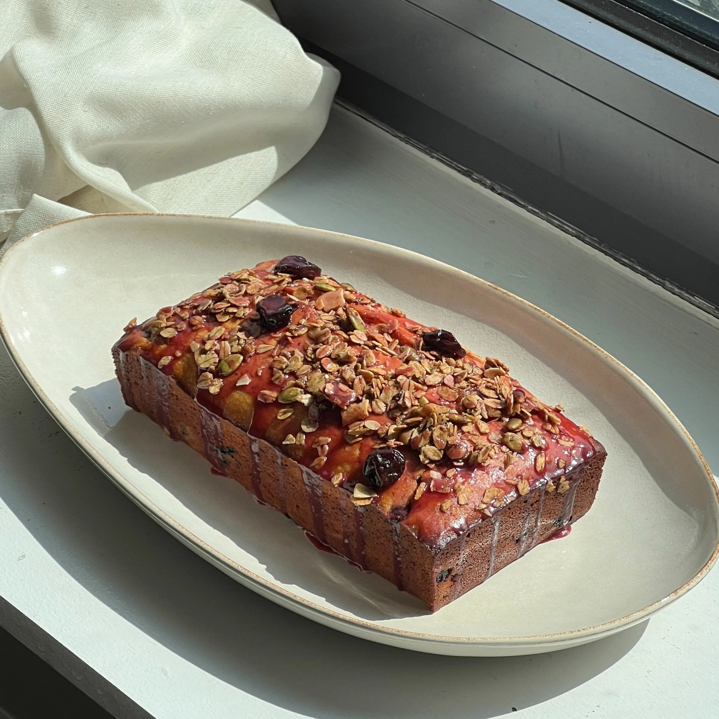 Lemon Skyr Loaf Cake with Cherry Glaze and Granola
